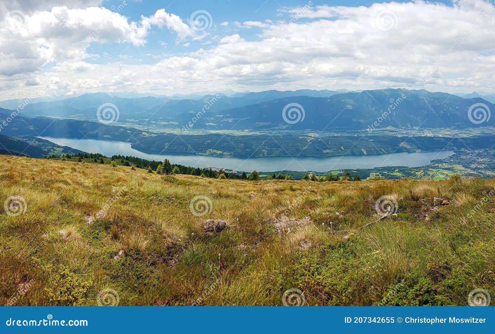 millstaettersee - a panoramic view on the millstaettersee from granattor in austrian alps. the lake is surrounded by mountains