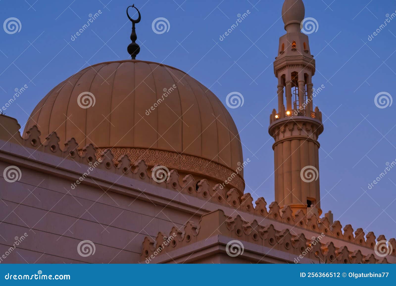 Minaret and Dome of Muslim Islamic Mosque on Sunset Background. Minaret