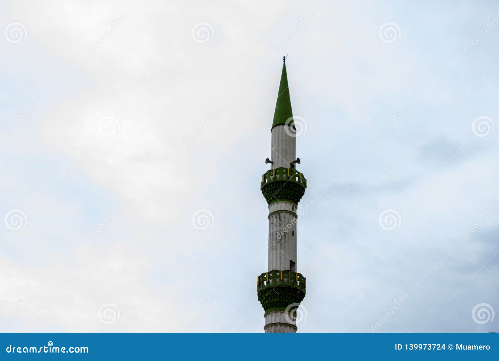 the minaret with the green details on it