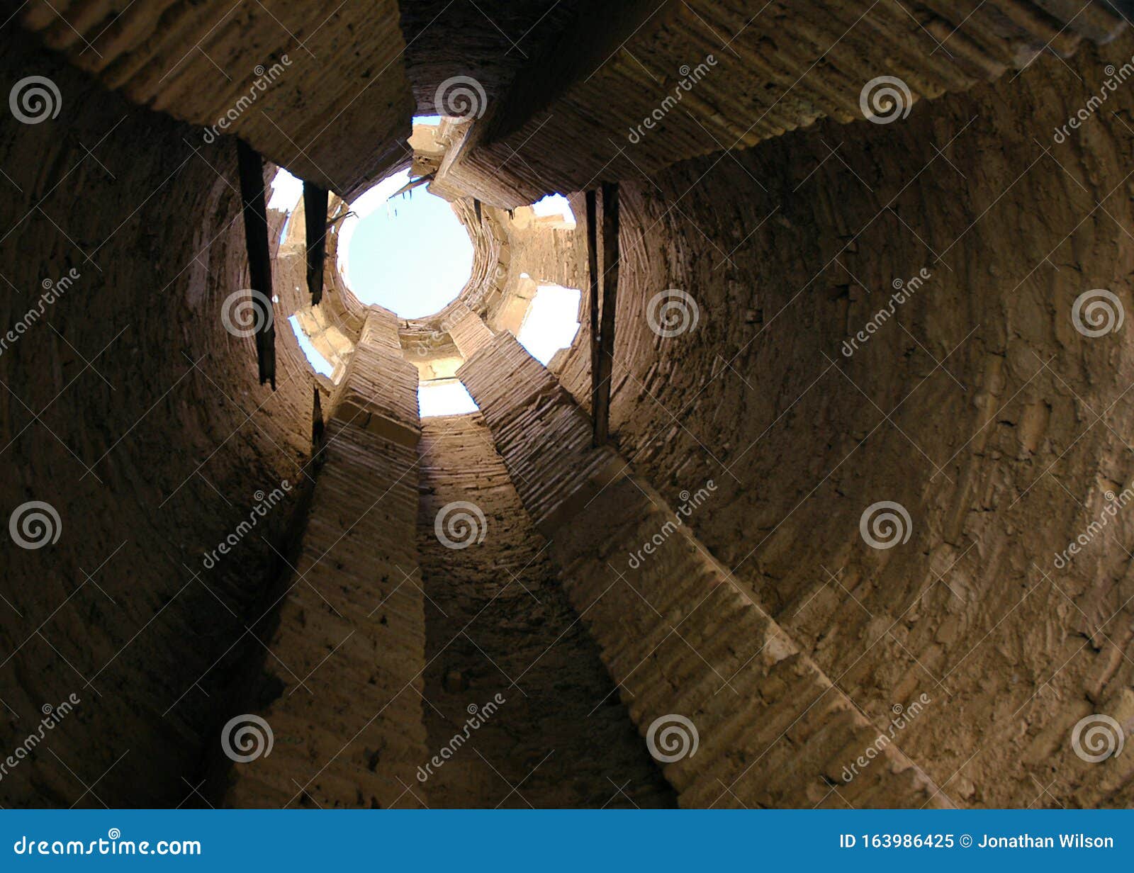 the minaret of jam, a unesco site in central afghanistan. view of the sky through the upper opening.