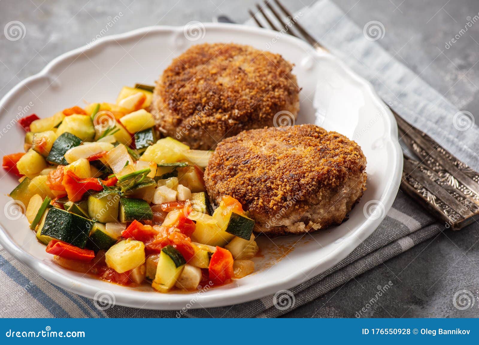 Minced Beef Cutlets Served with and Stewed Vegetables. Stock Photo