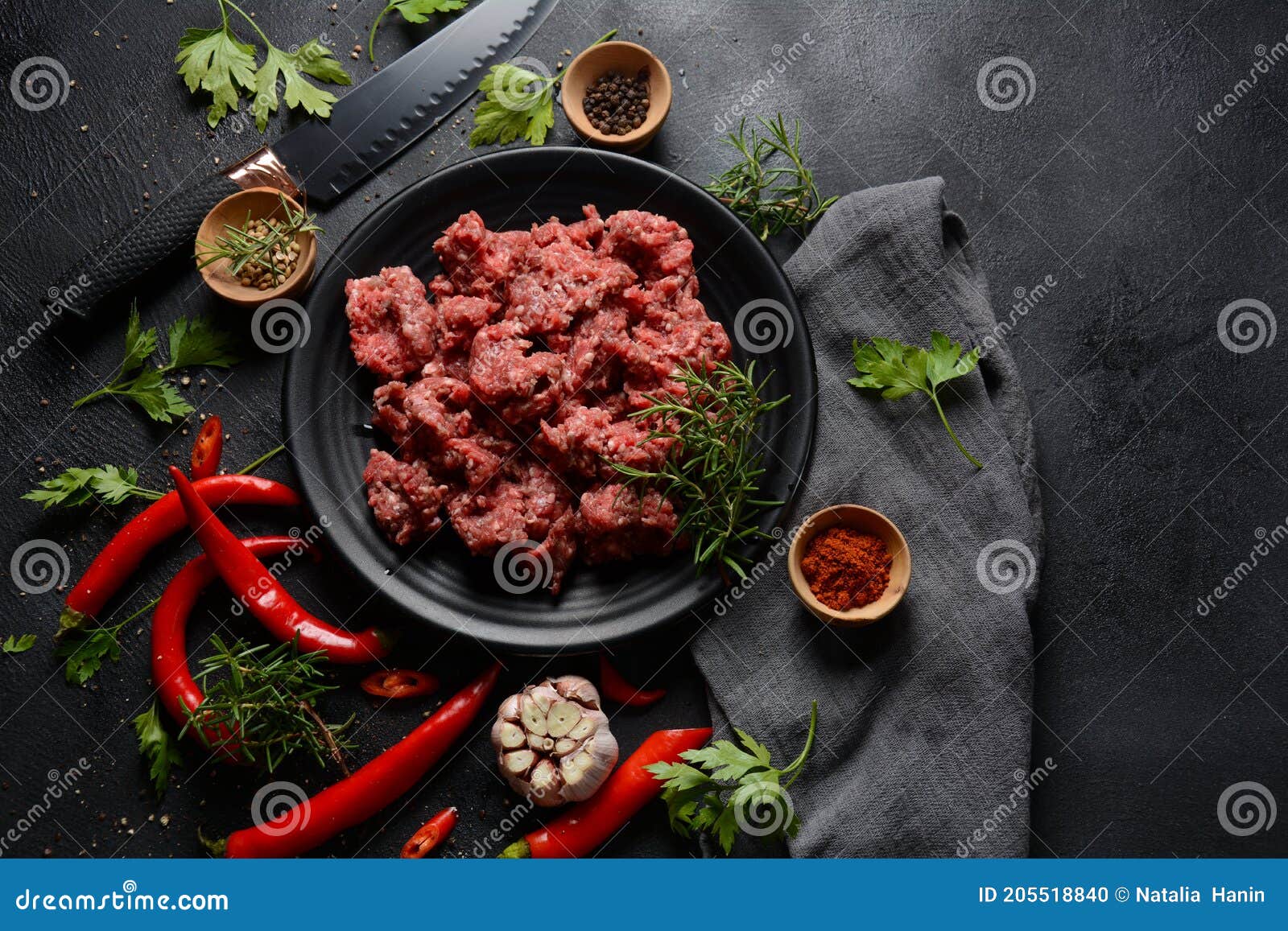 Minced Beef. Ground Meat with Ingredients for Cooking on Black