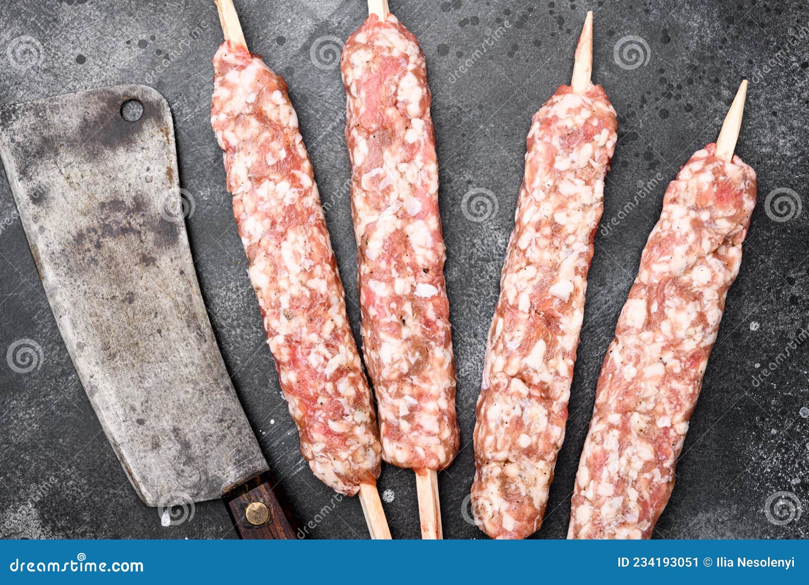 Minced and Shaped Lamb Mutton Kebabs, on Black Dark Stone Table