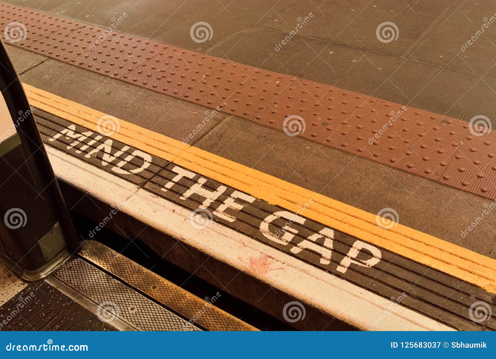 Mind the Gap Sign on Underground Platform. Stock Image - Image of
