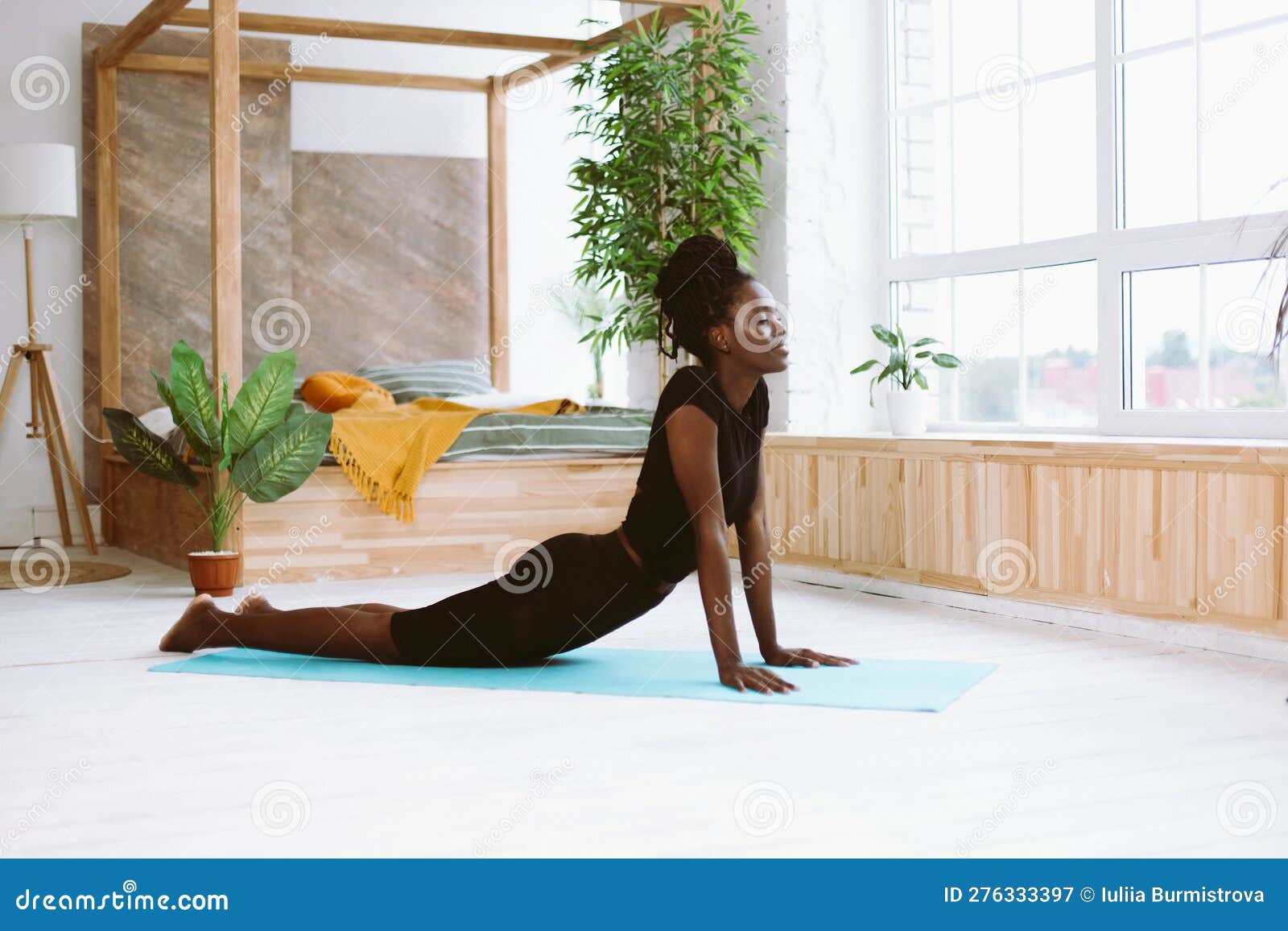 Mindful Dark Skin African American Woman with Close Eyes Do Yoga