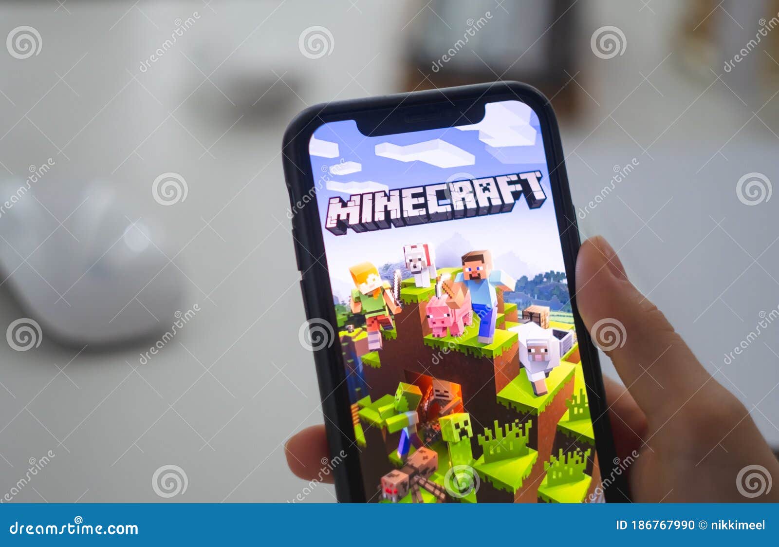 Minecraft Game on the IPhone Screen in Hand. Editorial Image Image of