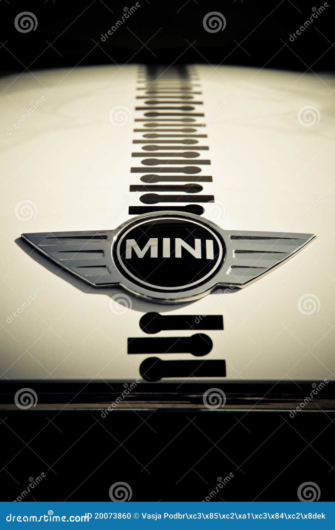 Photo of a Retro Mini Cooper Car Logo Badge on a Red Mini Cooper Car.  Editorial Photo - Image of chrome, motor: 144682971