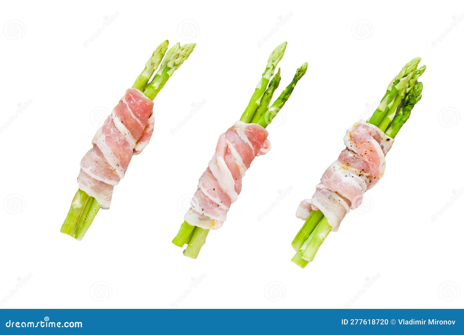 Mini Asparagus in Bacon on a Baking Sheet. Isolated on White Background