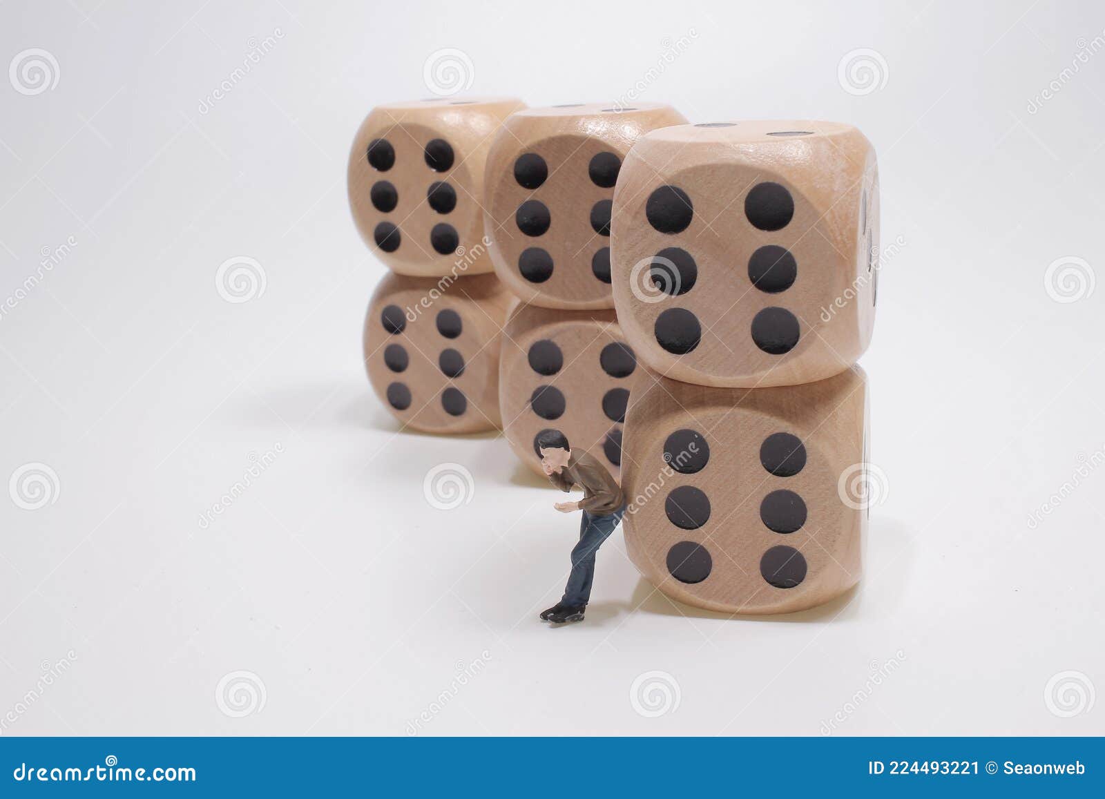 A Mini Business People with Dice and Talking the Phone Stock Image