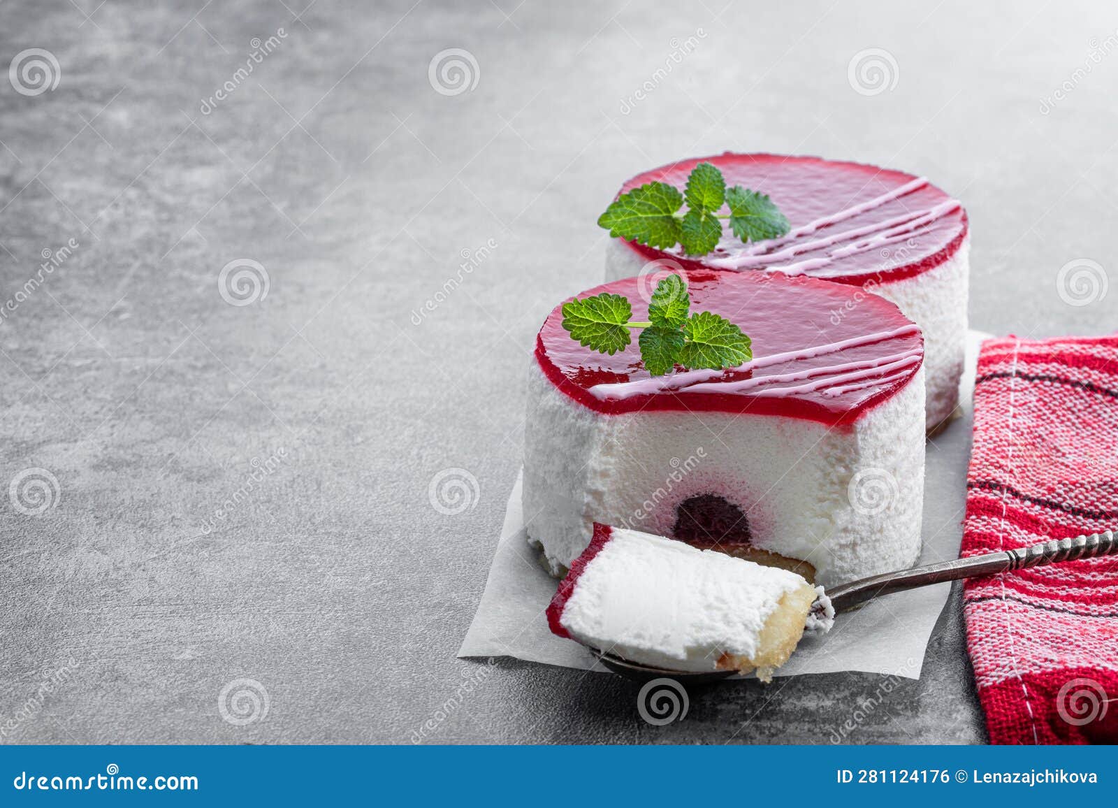 Mini Cheesecakes with Red Fruits Jam Topping on Gray Background Stock