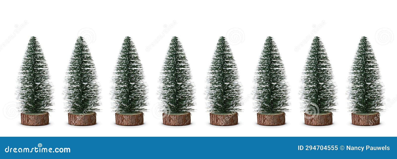 Mini Christmas Trees in a Row Isolated on White Background. Stock Image