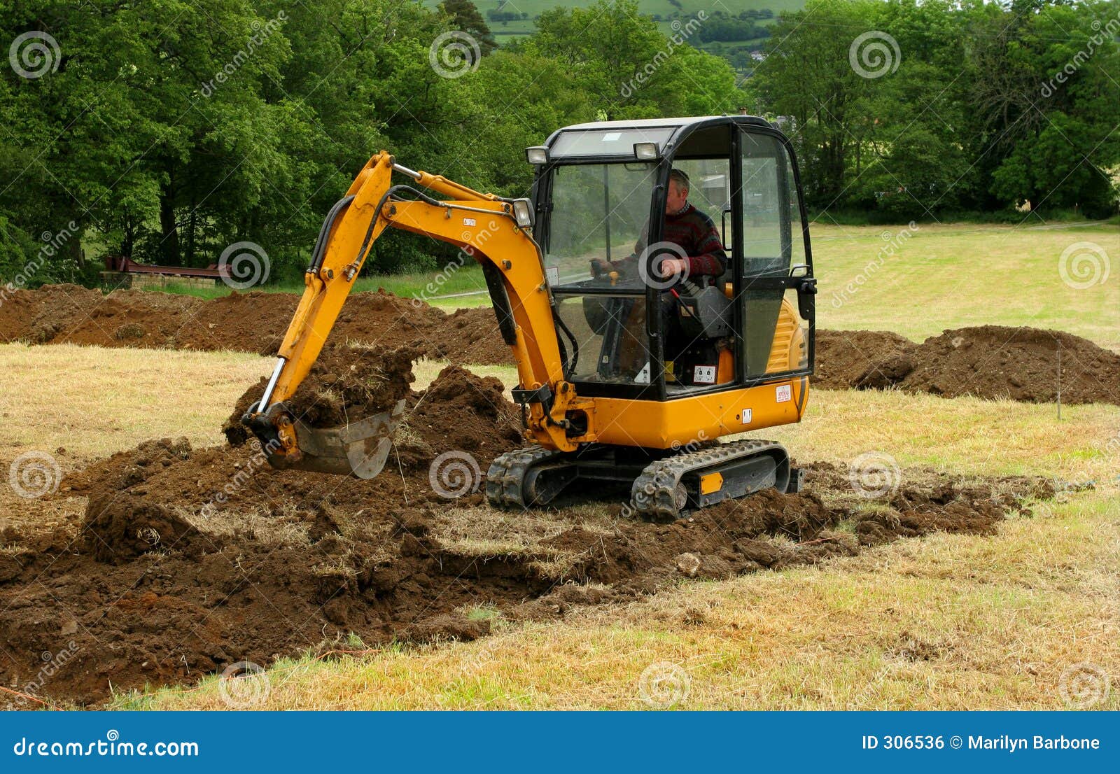 mini digger in action