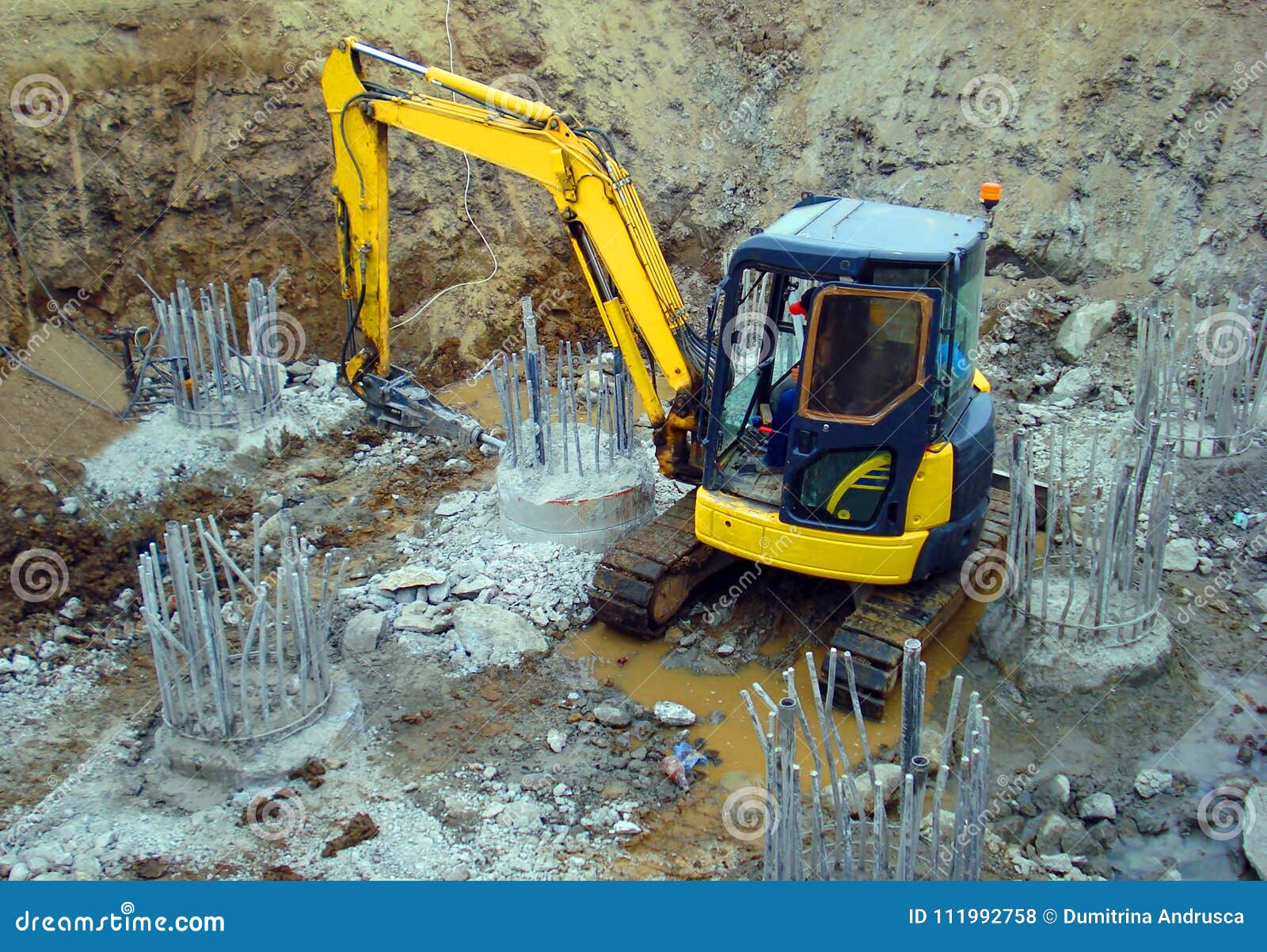 Mini excavator yellow stock photo. Image of engineering 111992758