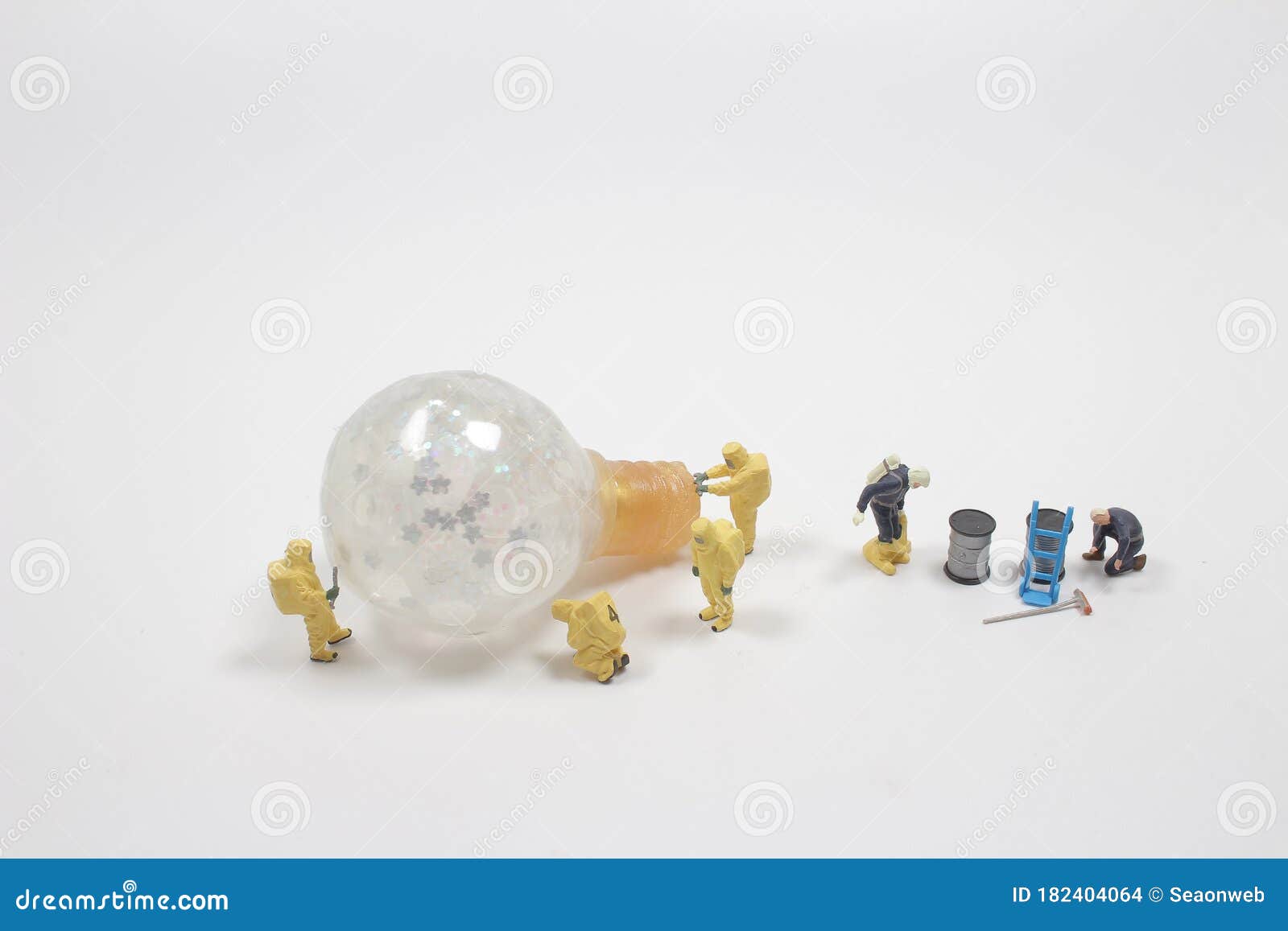 The Mini Figure with the Light Bulb , Innovation Theme Stock Photo