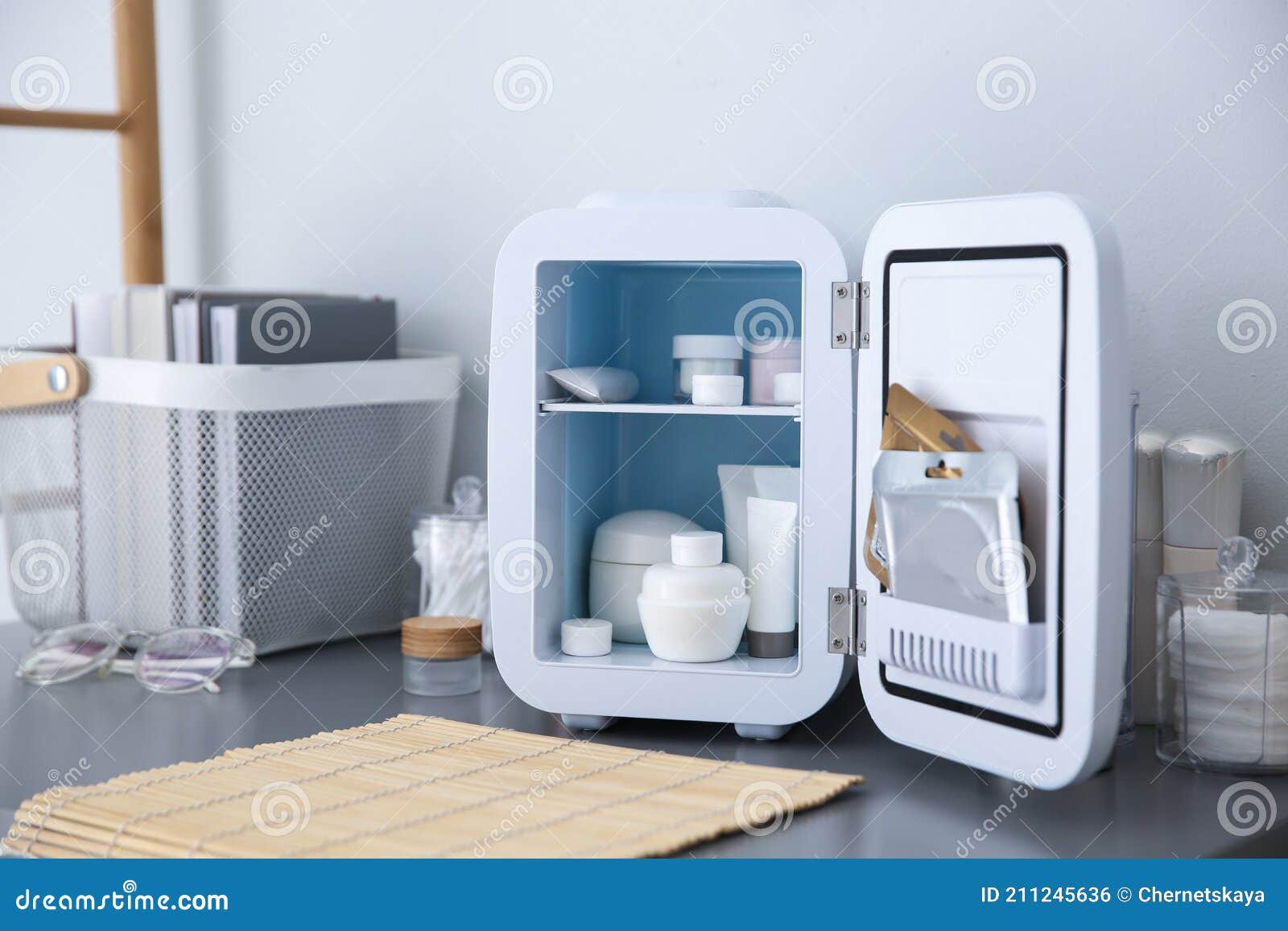 https://thumbs.dreamstime.com/z/mini-fridge-cosmetic-products-grey-vanity-table-indoors-mini-fridge-cosmetic-products-grey-vanity-table-211245636.jpg