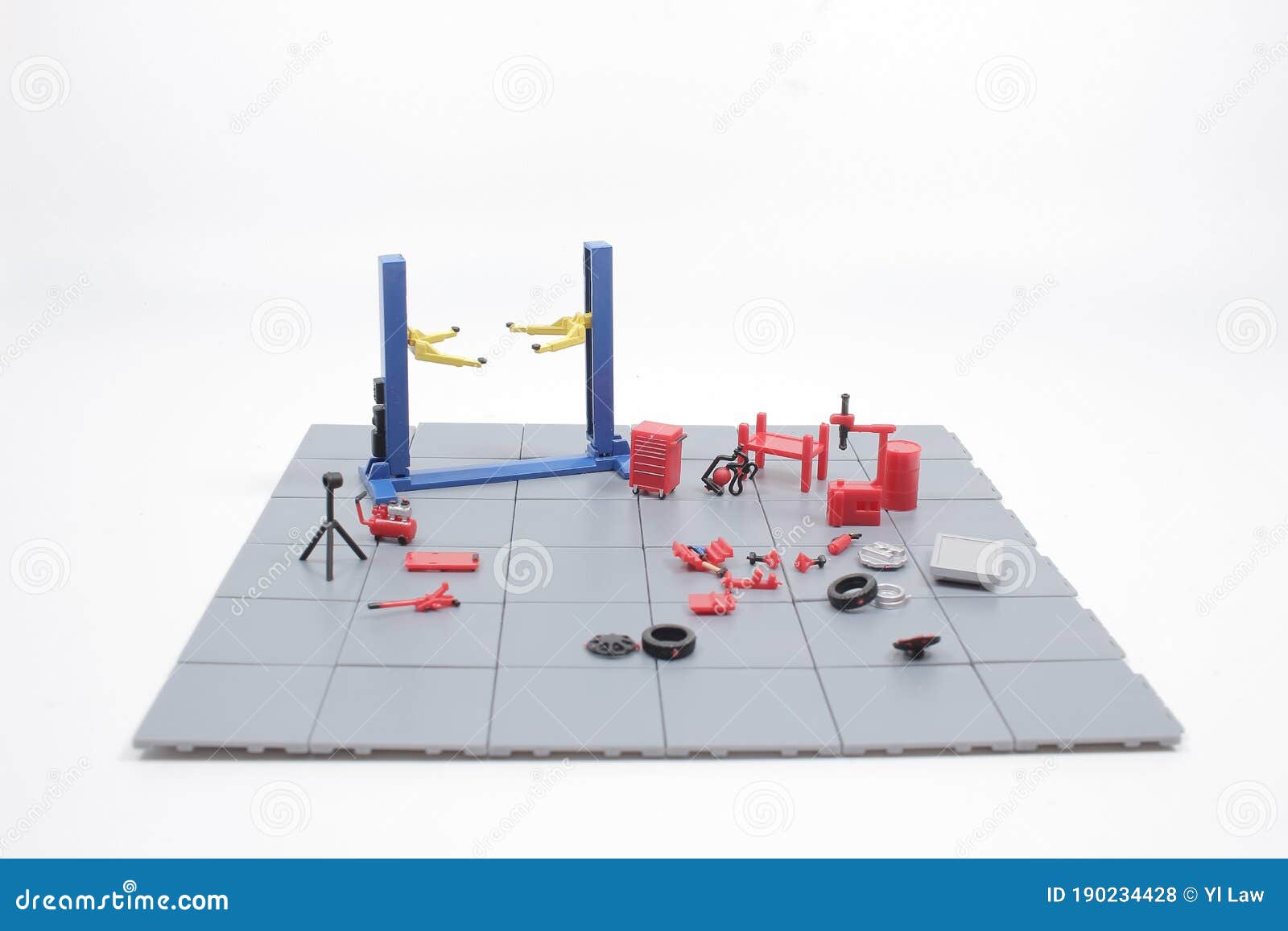 A Mini Mechanics Repairing Toy Car,concept of the Stock Photo