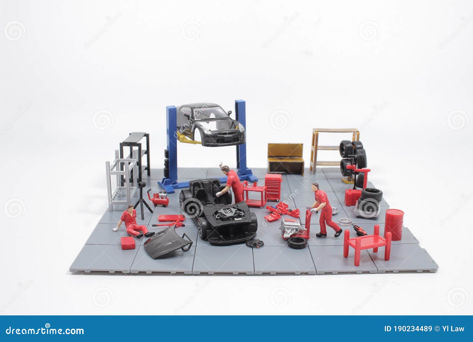 A Mini Mechanics Repairing Toy Car,concept of the Stock Image