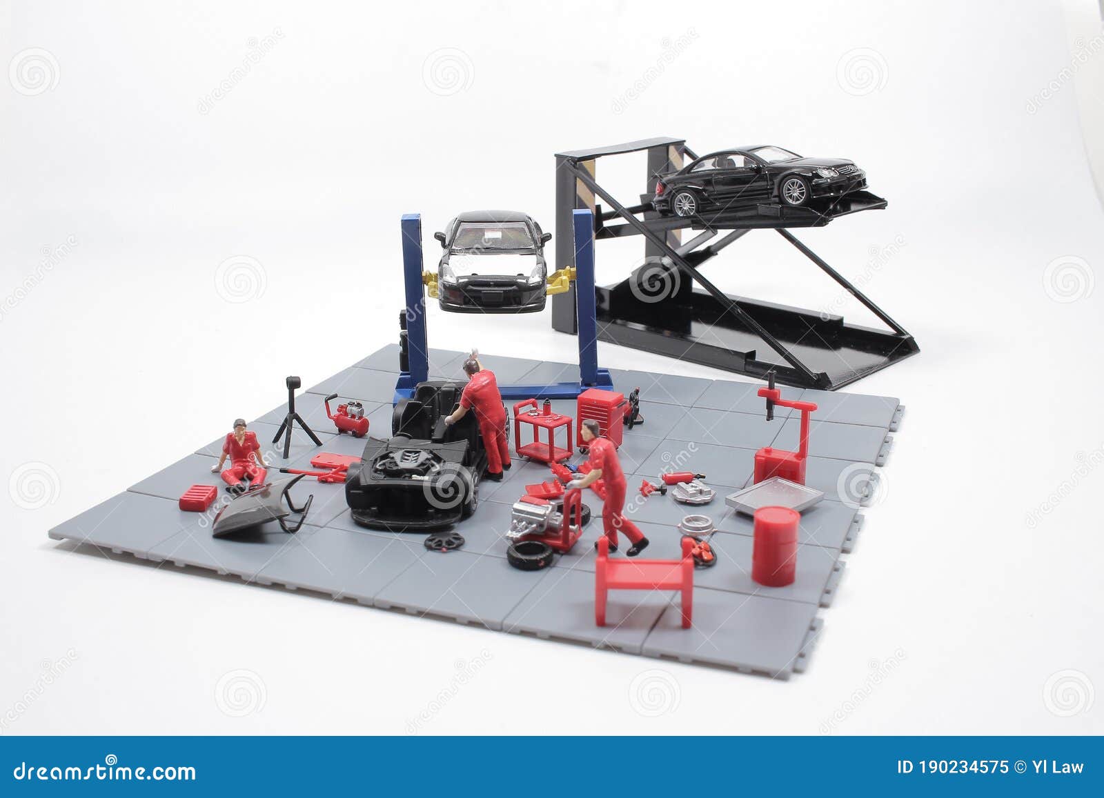 A Mini Mechanics Repairing Toy Car,concept of the Stock Image