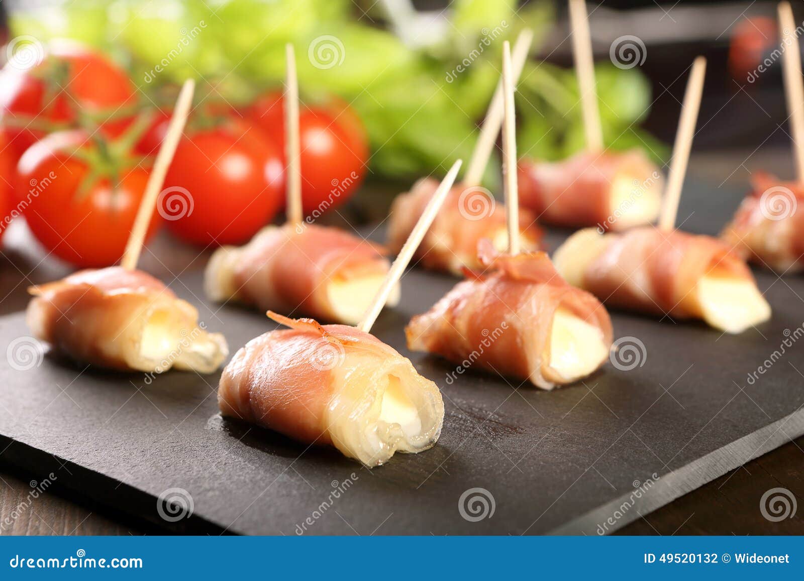 Mini Mozzarella Wrapped in Prosciutto Ham and Baked Stock Photo Image