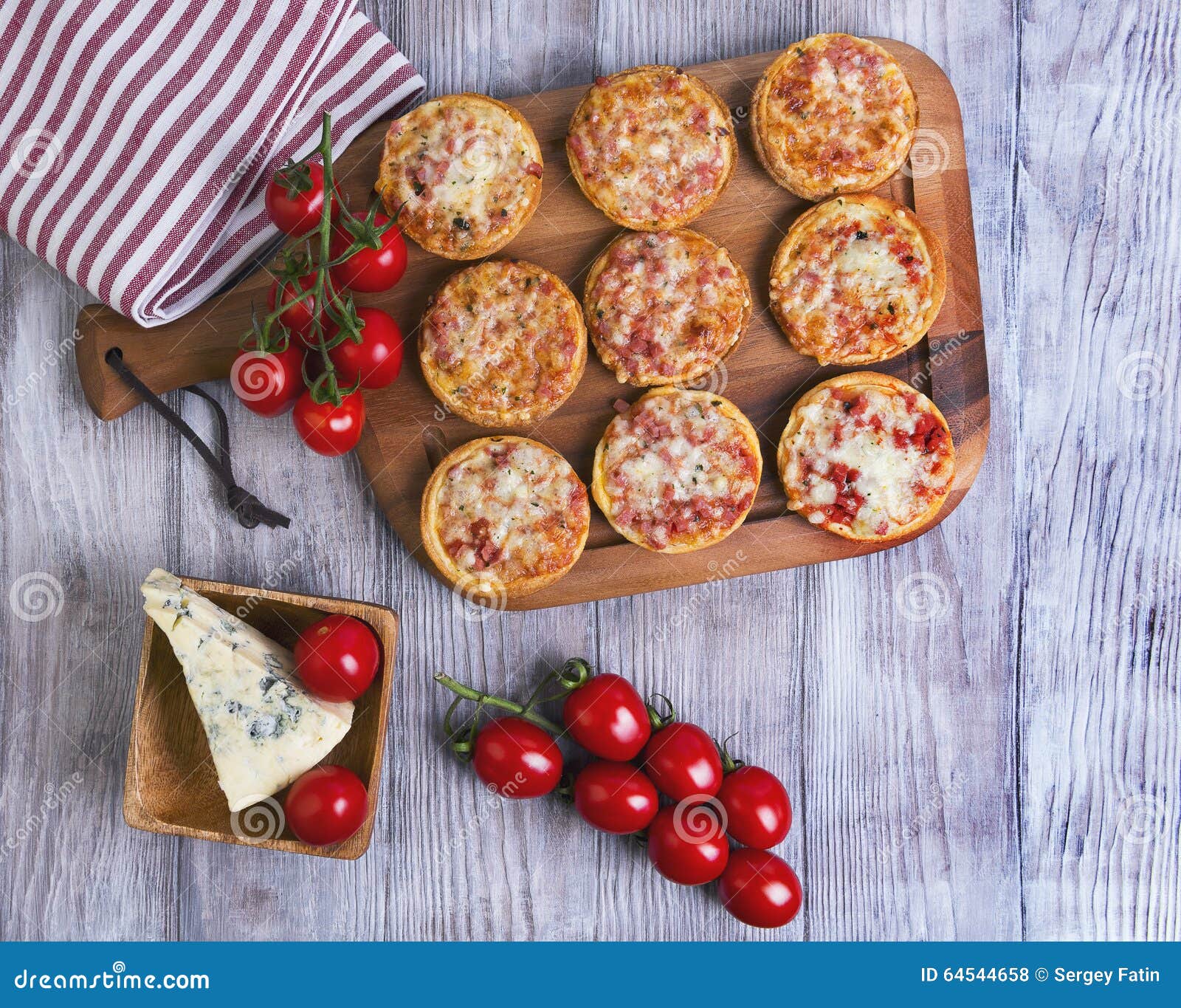 Mini Pizzas on a Wooden Table Stock Photo - Image of homemade, basil ...