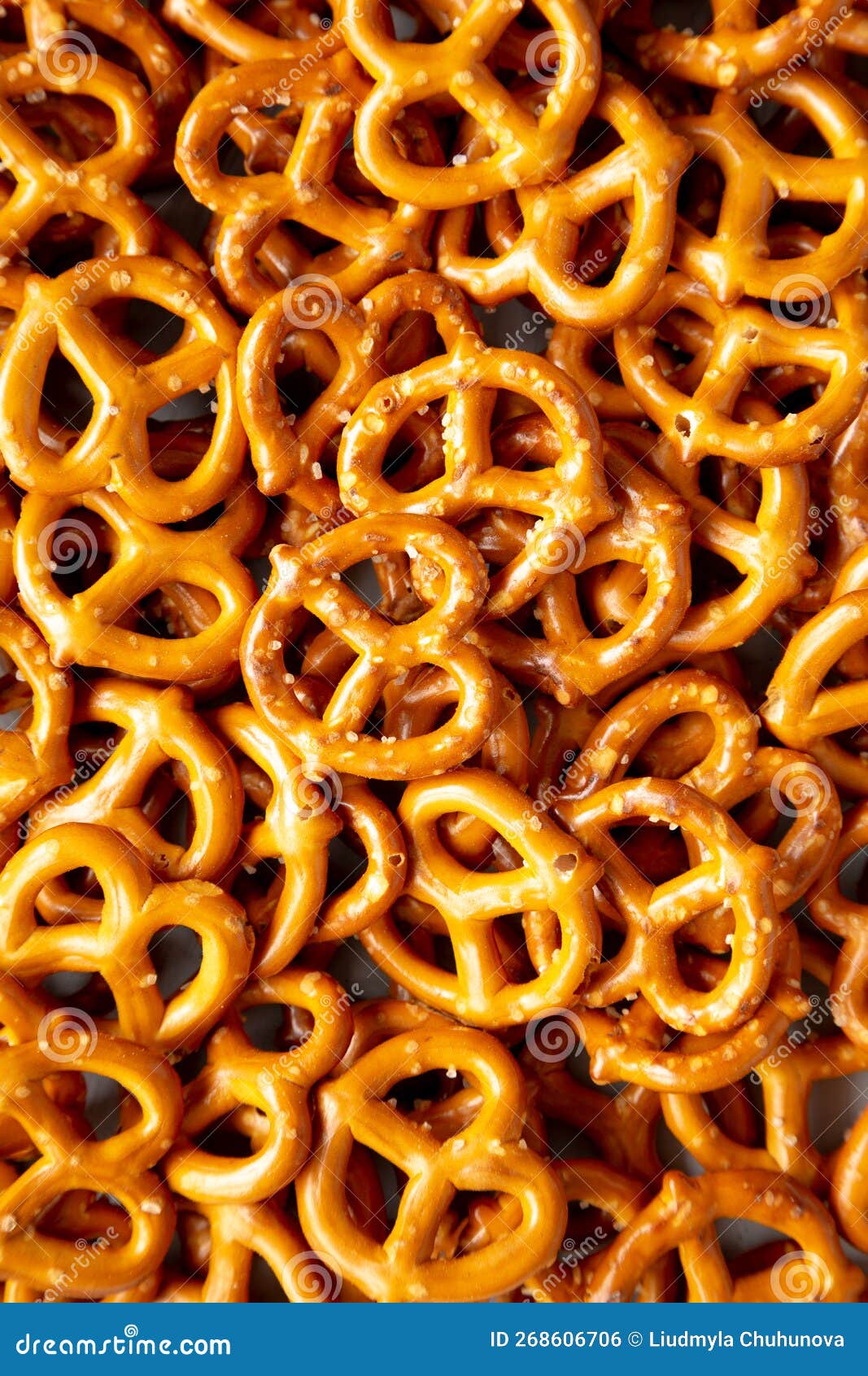 Mini Pretzels with Salt on a Gray Surface, Top View. Flat Lay, Overhead