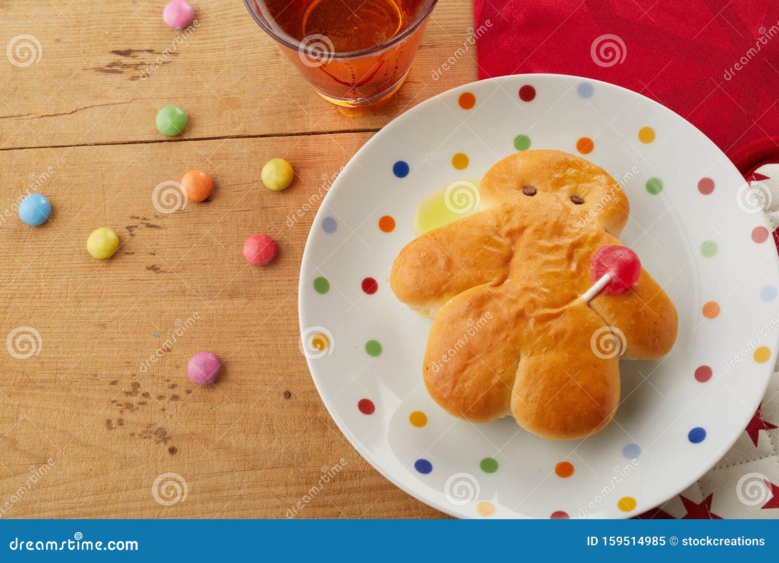 mini stuten bread man on a polka dot plate