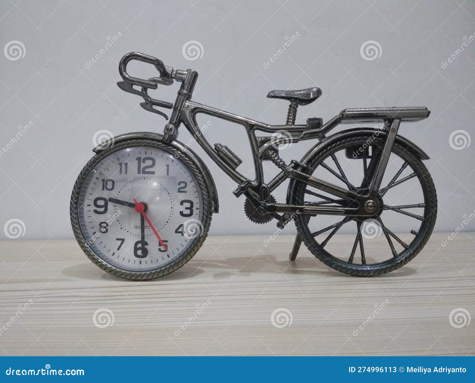 Miniature Bicycle with a Clock Combination on the Front Wheel Stock