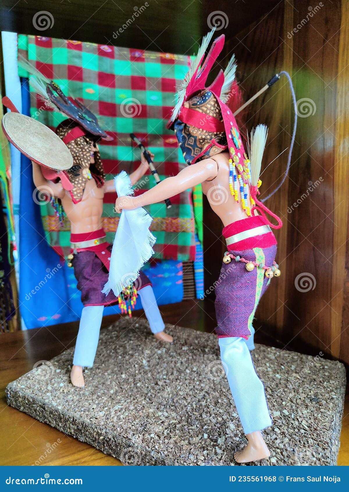a miniature of the caci dance which is a traditional war dance of east manggarai tribe displayed on shop in airport for sold