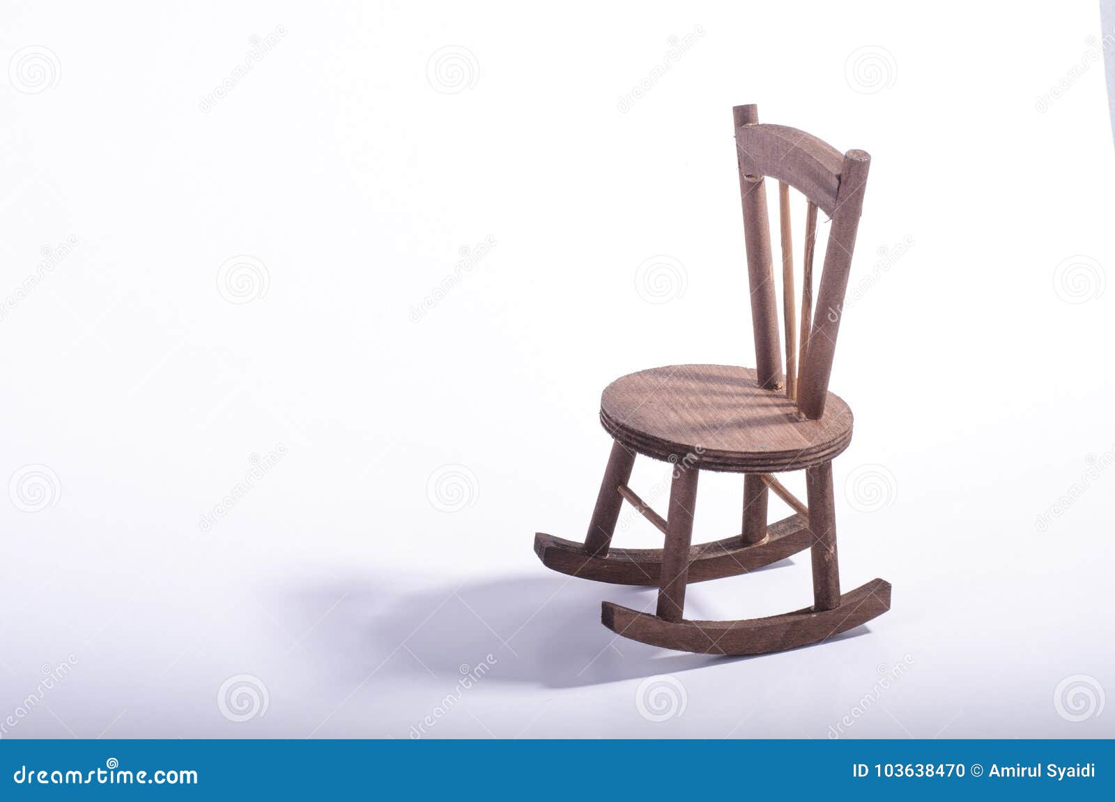 Miniature Chair On Wooden Floor Expressing Lonely Feeling