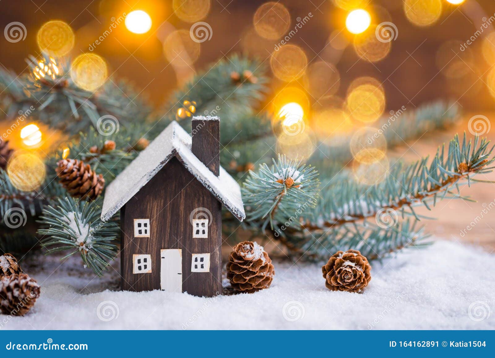 Miniature Christmas Wooden House on the Snow Over Blurred Snowflakes ...