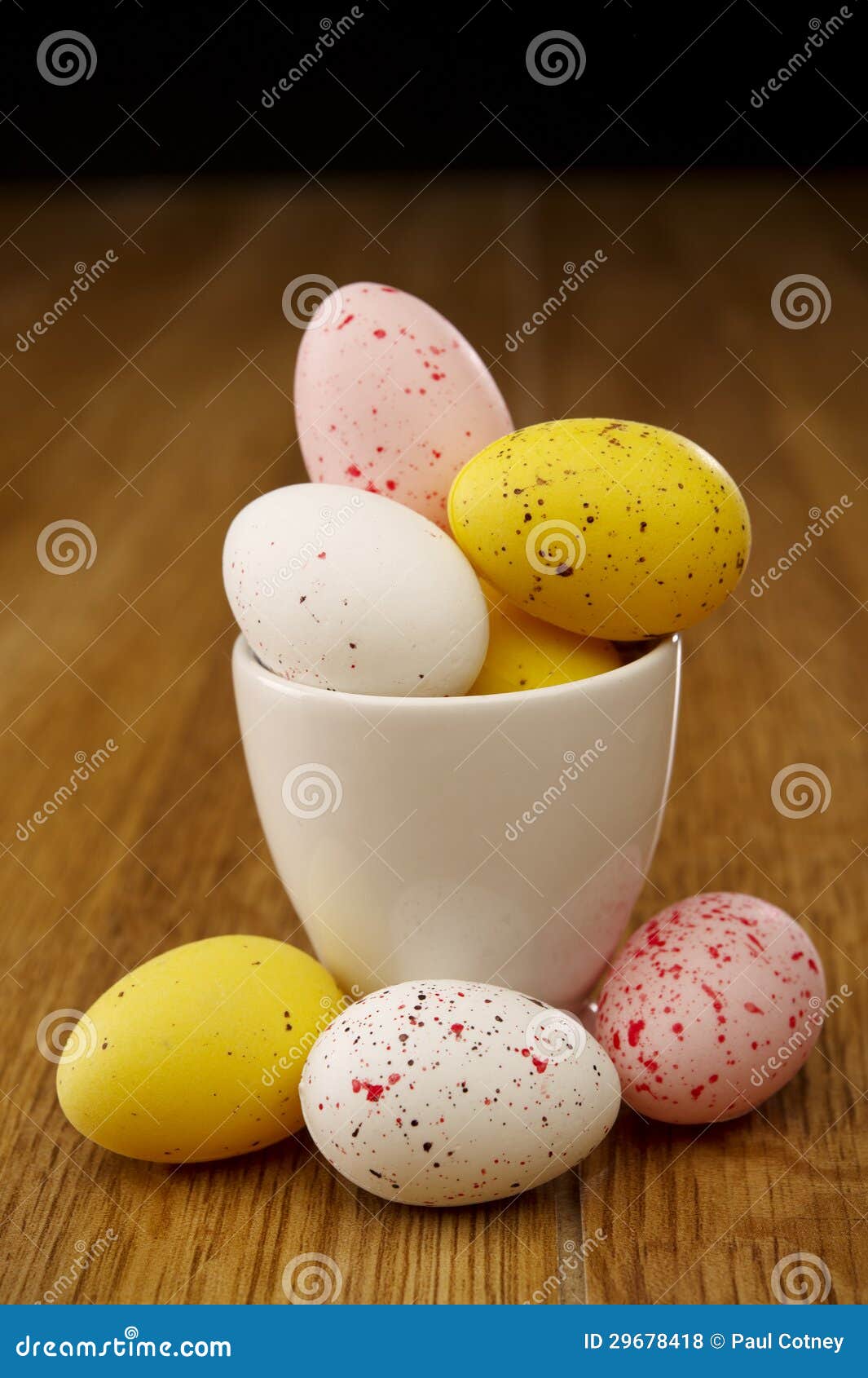 Miniature Coloured Eggs in an Egg Cup Stock Photo - Image of colorful ...