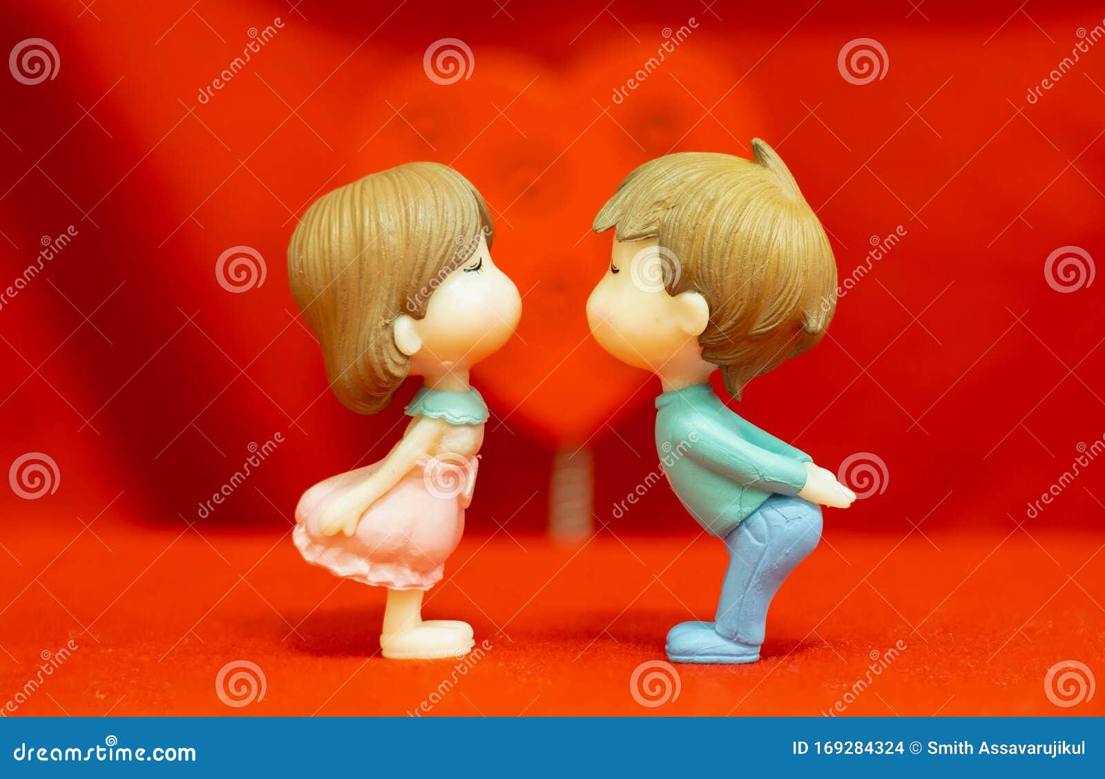 The Miniature Couple Dolls Boy and Girl Romantic Kiss on Red Heart ...