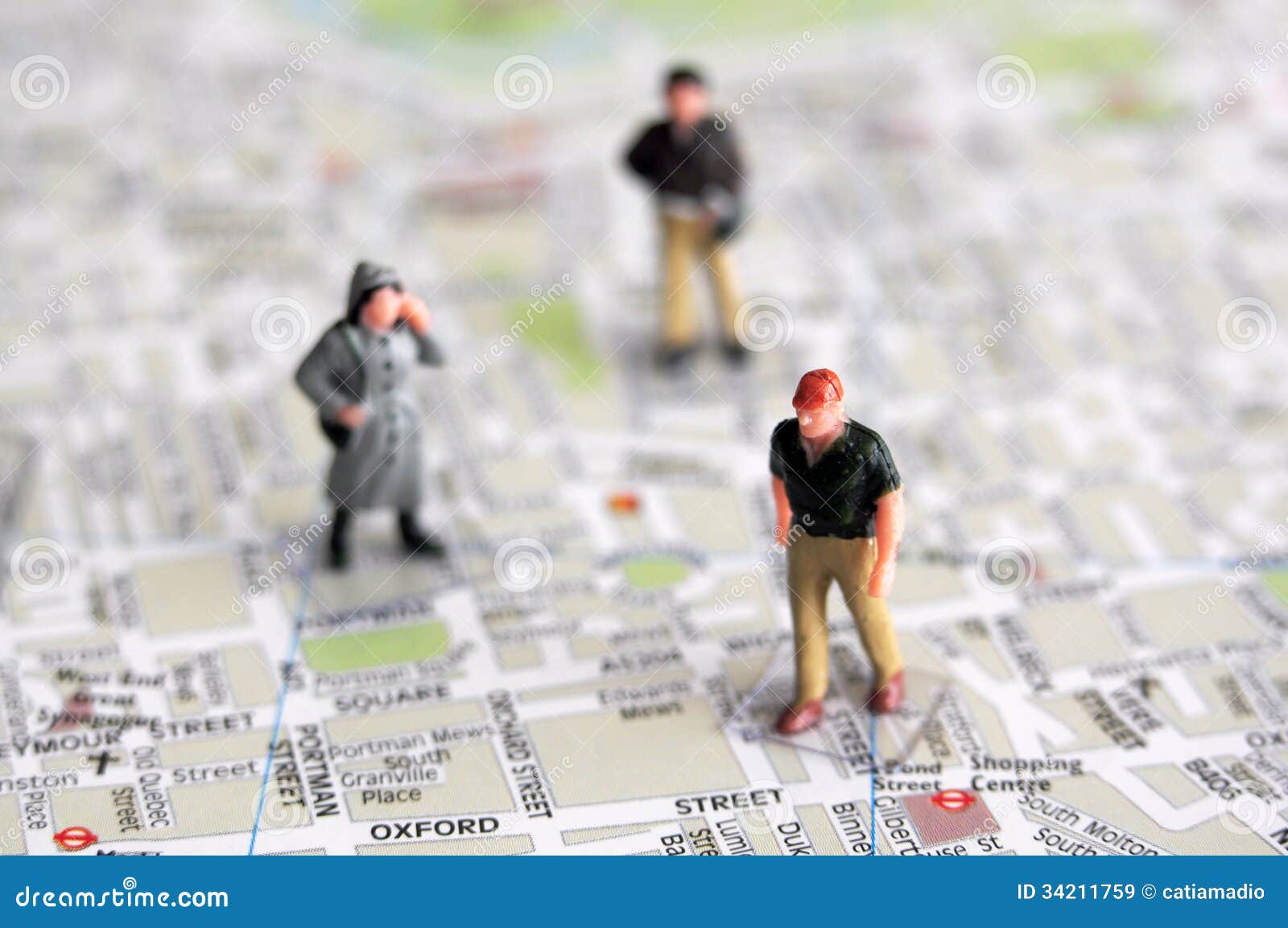 miniature people and city map