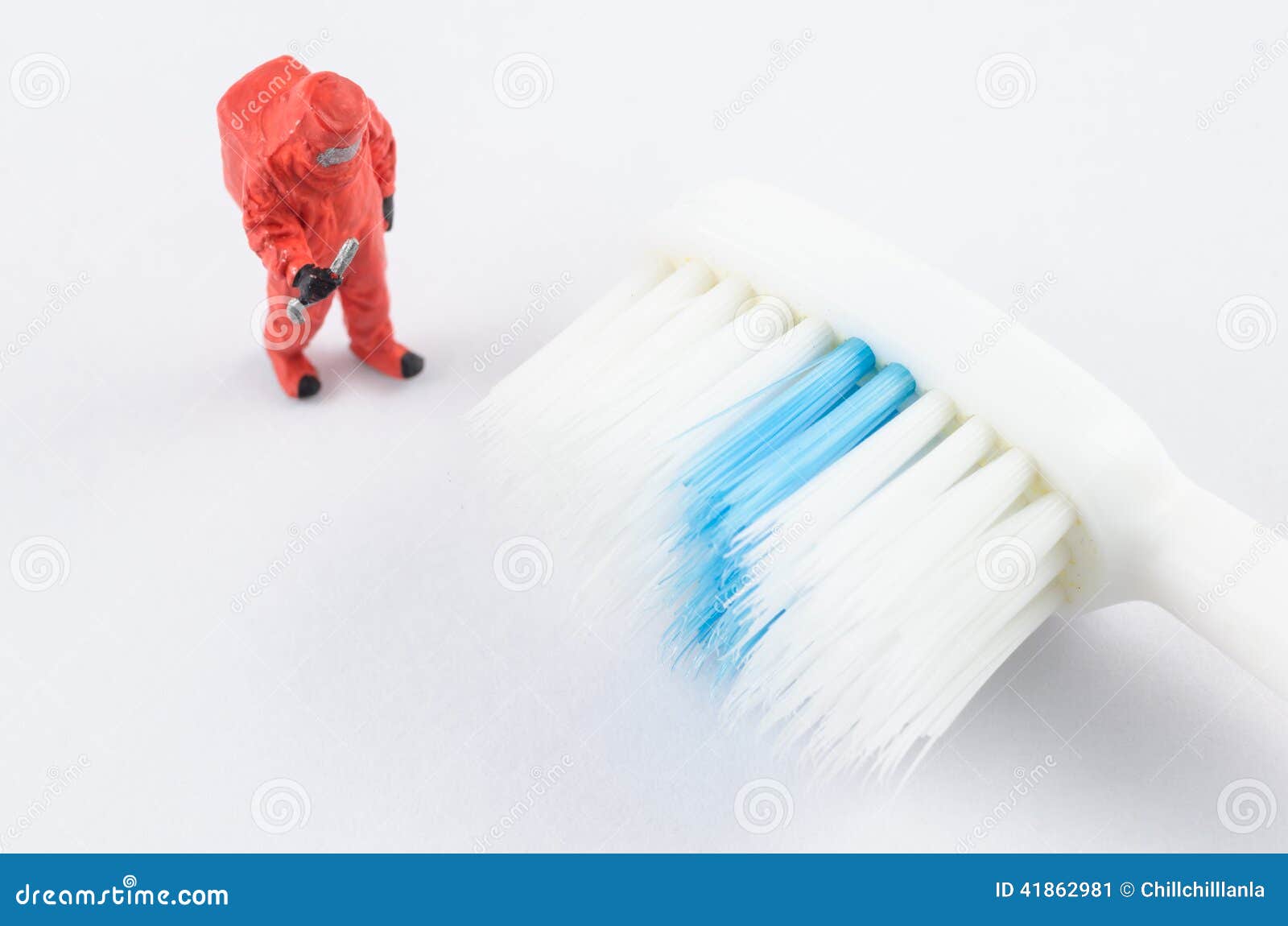 Miniature Scientist Checking Bacteria on the Toothbrush Stock Image