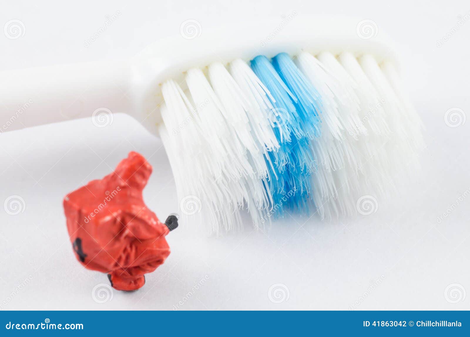 Miniature Scientist Checking Bacteria on the Toothbrush Stock Photo