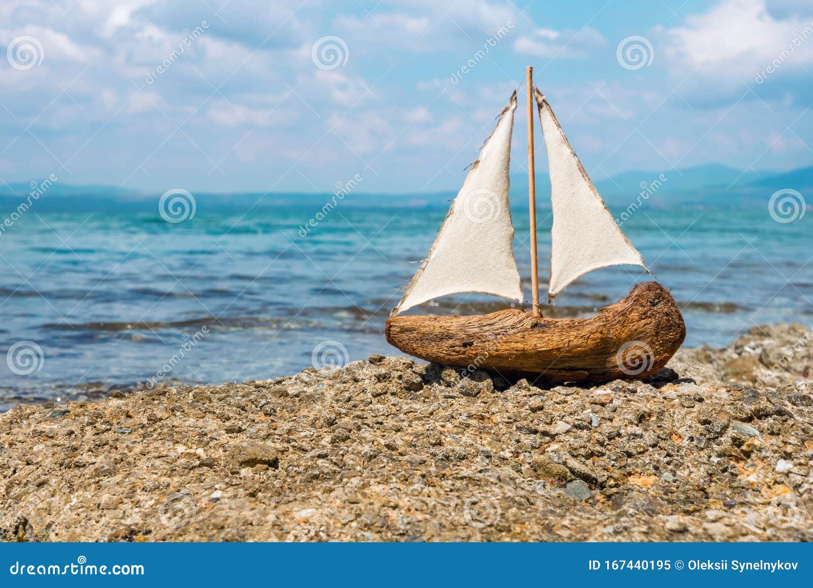 toy boat in the sea waves. travel concept. sailer on beautiful seascape background. water sports concept. fascinating