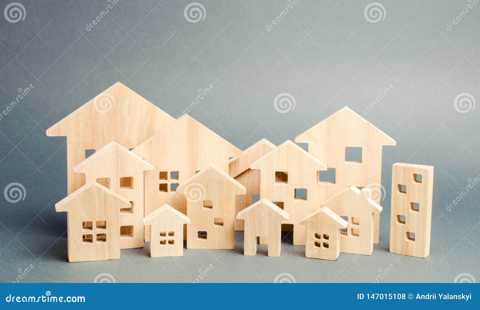 miniature wooden houses. real estate. city. agglomeration and urbanization. real estate market analytics. demand for housing.