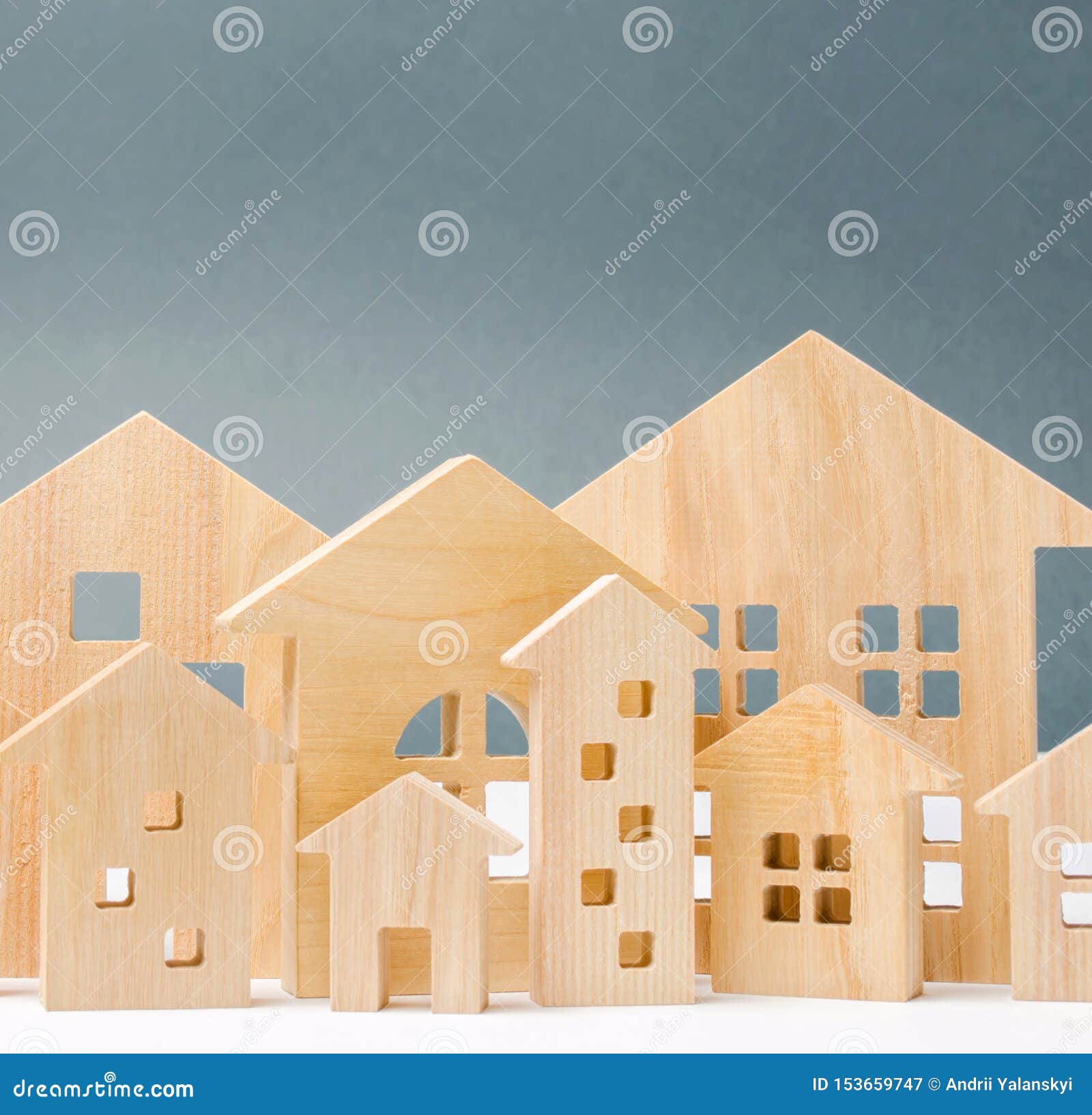 miniature wooden houses. real estate. city. agglomeration and urbanization. real estate market analytics. demand for housing.