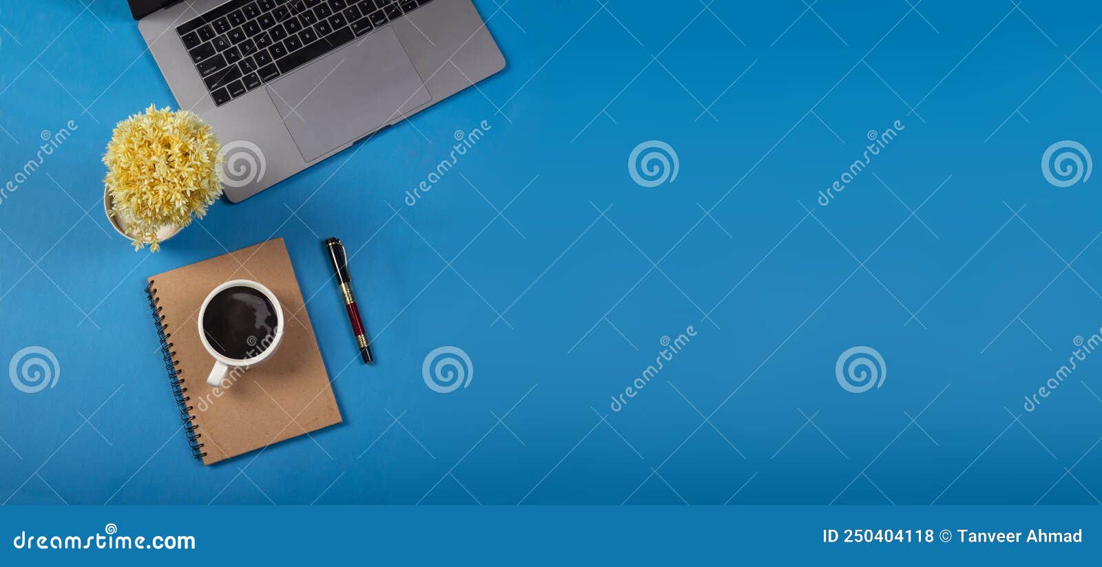 Minimalist Office Table with Blue Background and Office Supplies Stock