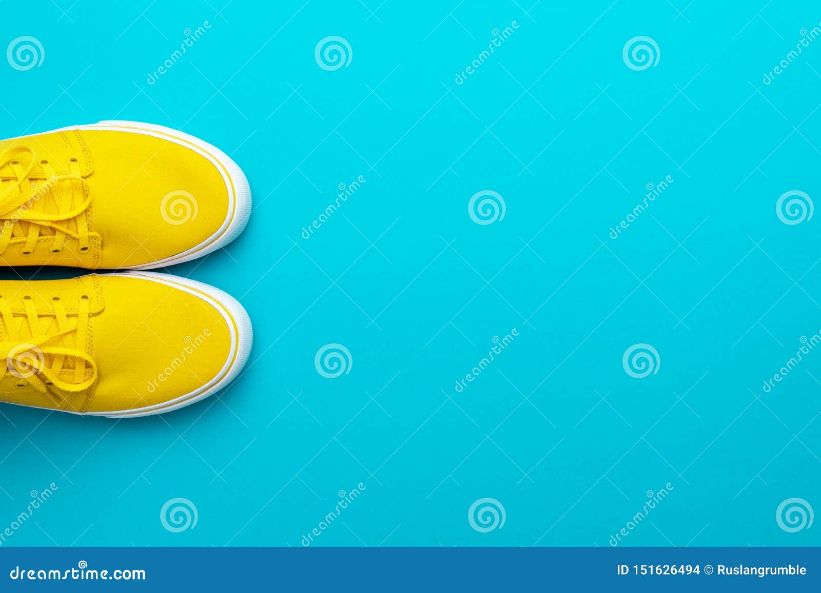 Minimalist Photo of Yellow Sneakers with Tied Shoelaces and Copy Space ...