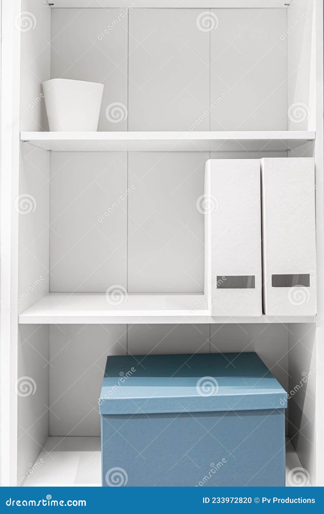 A Minimalist Wardrobe, Halfempty Shelves in a White Wardrobe. Stock
