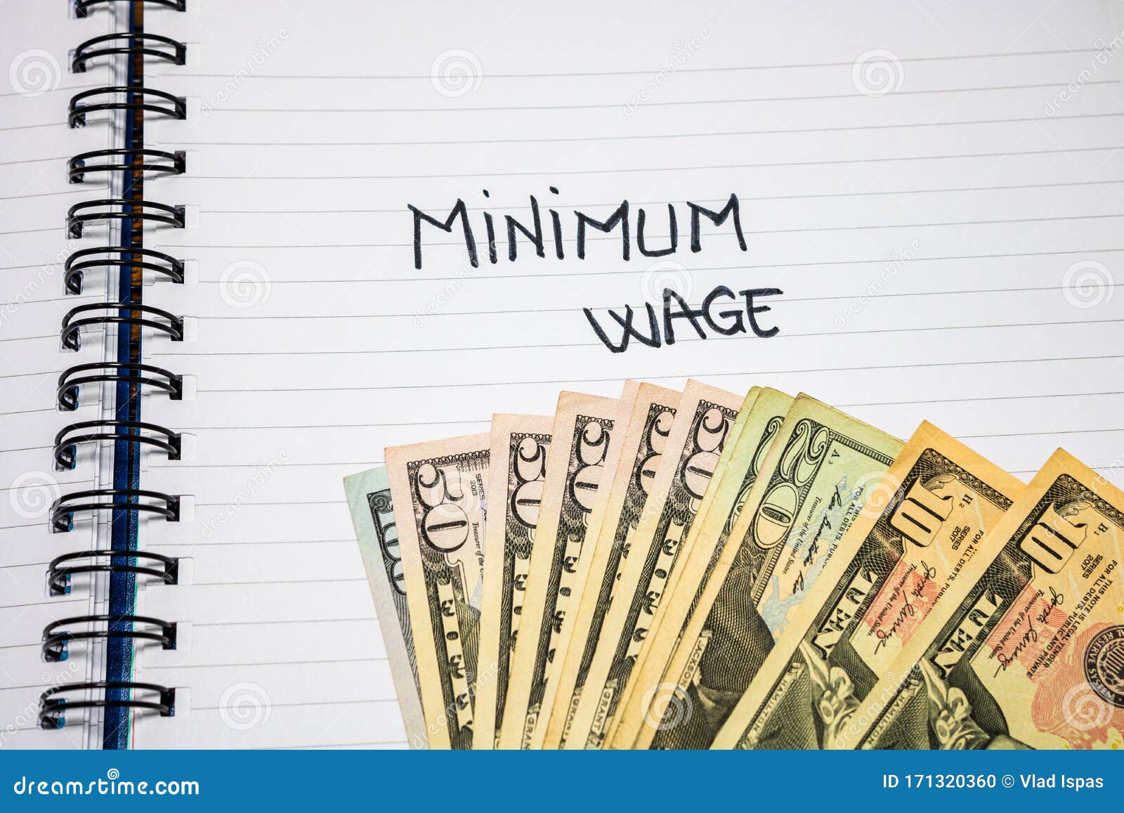 minimum wage handwriting  text on paper, on office agenda. copy space