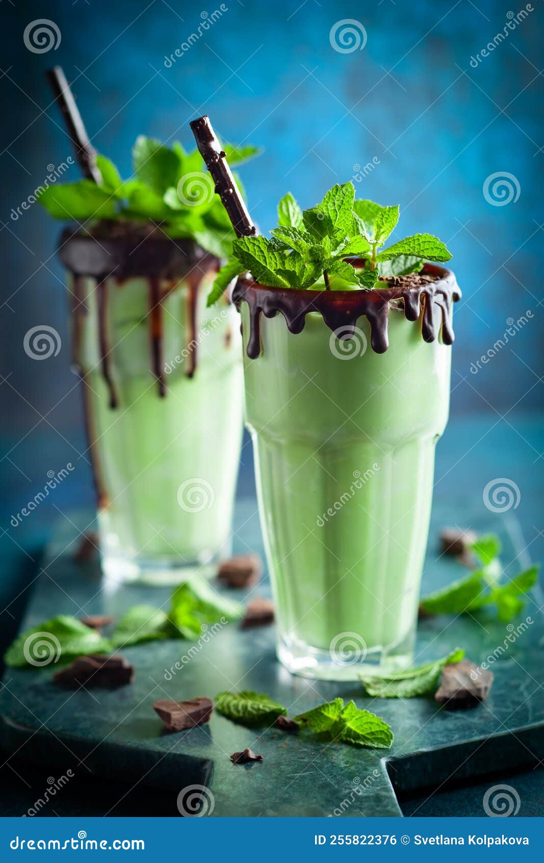 Mint Chocolate Milkshake Stock Photo Image Of Season 255822376 a-smoothie-in-a-glass-with-strawberries-next-to-it-on-a-wooden-table