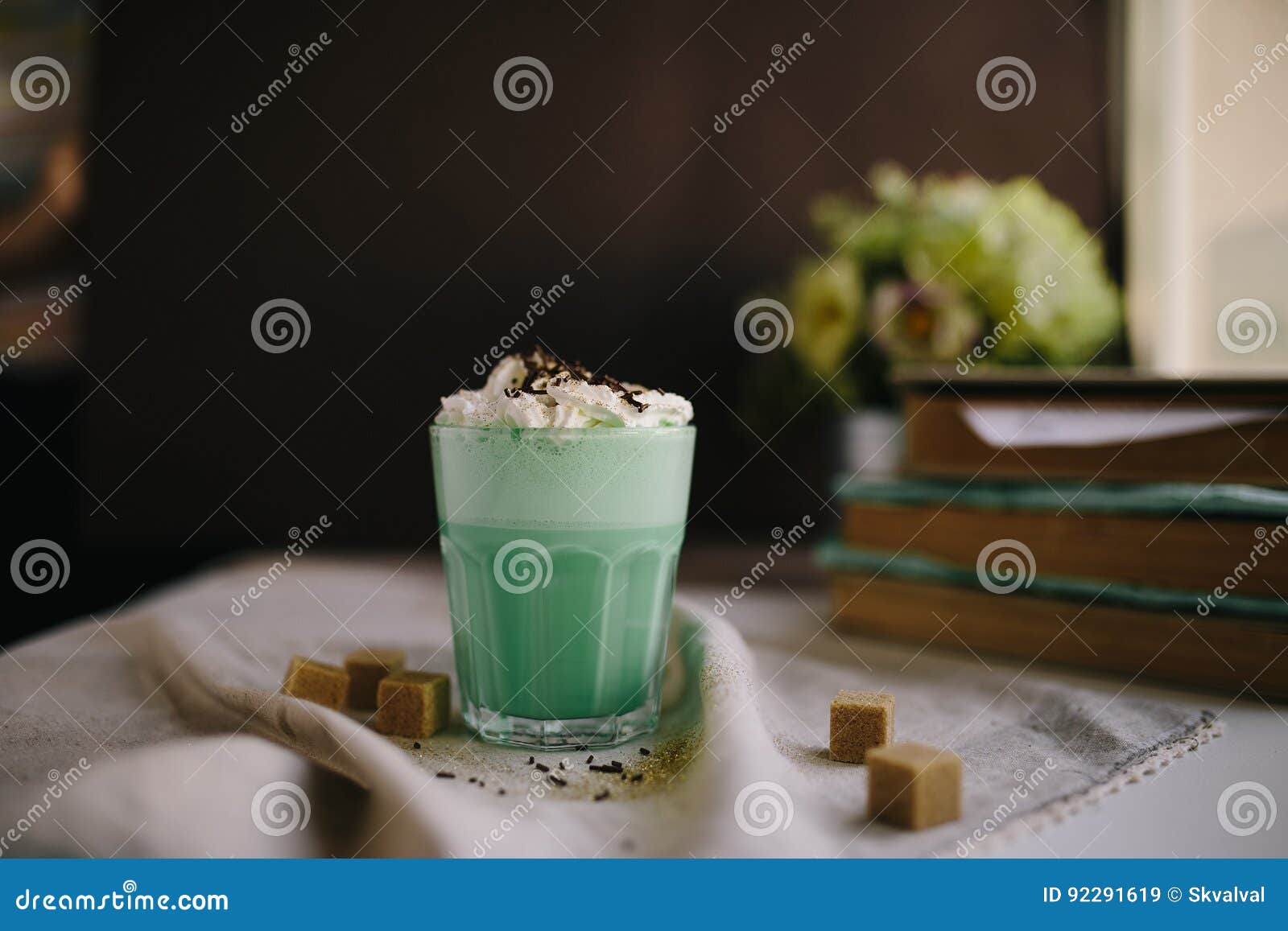 mint coffee with with cream and colorful decoration on dark background. milk shake, cocktaill, frappuccino. unicorn coffee, unico
