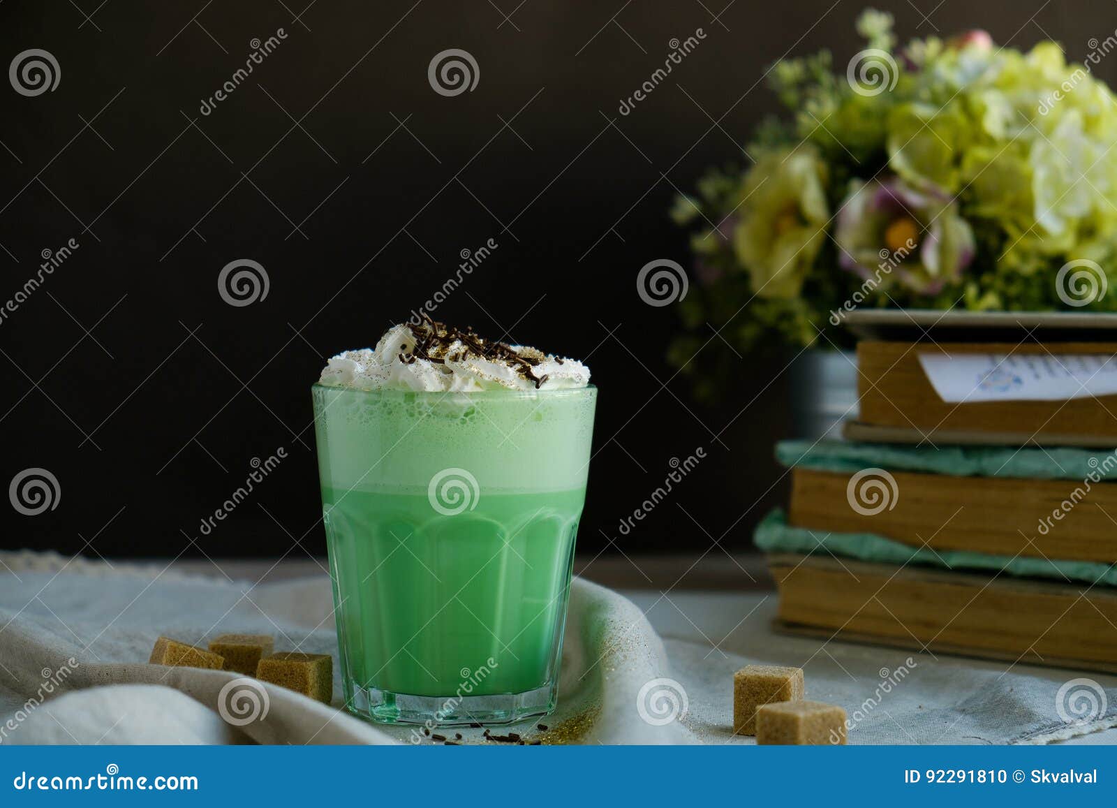 mint coffee with with cream and colorful decoration on dark background. milk shake, cocktaill, frappuccino. unicorn coffee, unico