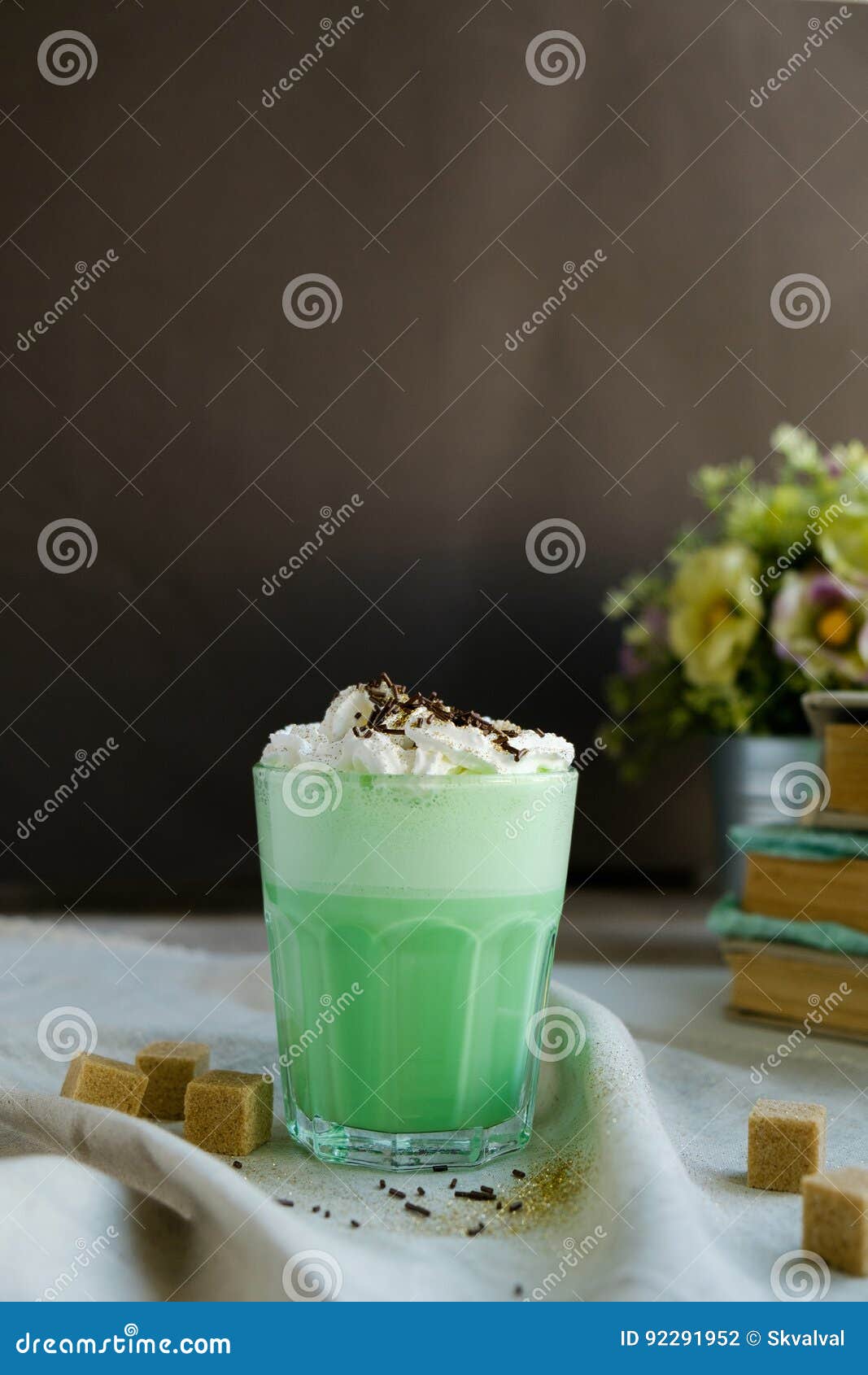 mint coffee with with cream and colorful decoration on dark background. milk shake, cocktaill, frappuccino. unicorn coffee, unico