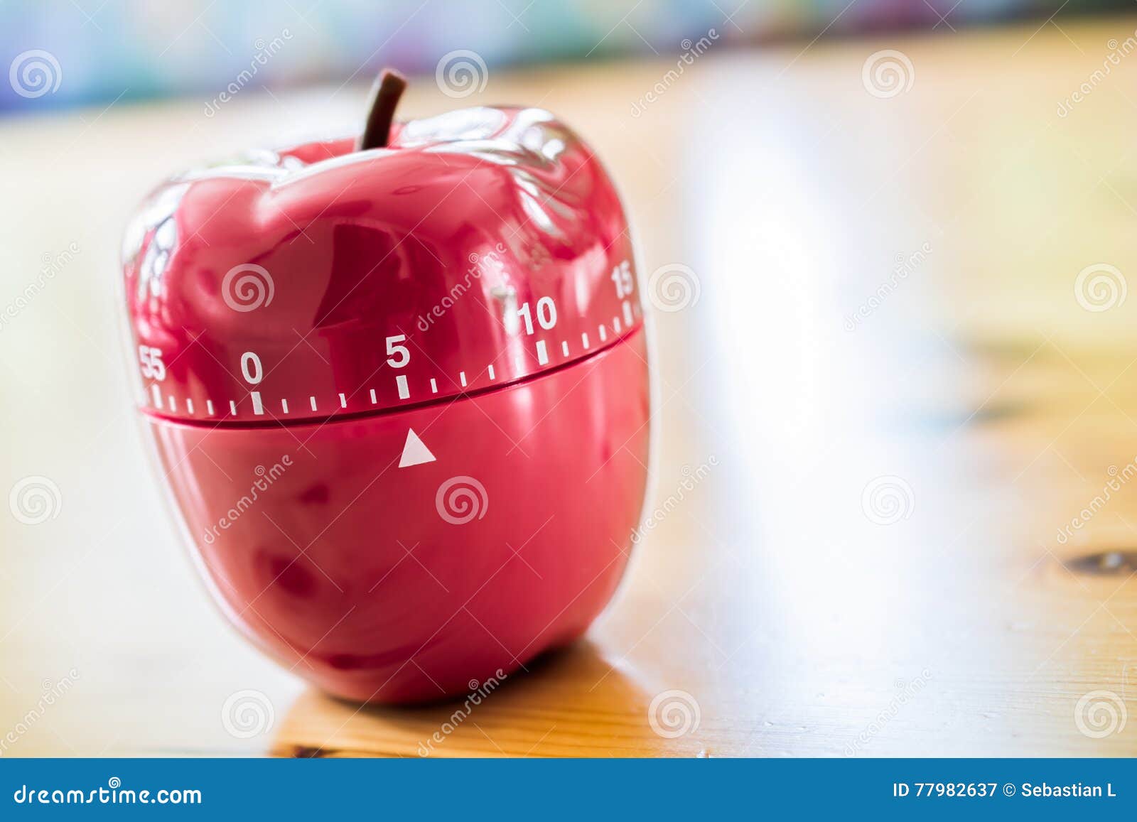 5 Minutes Kitchen Egg Timer in Apple Shape on Wooden Table Stock