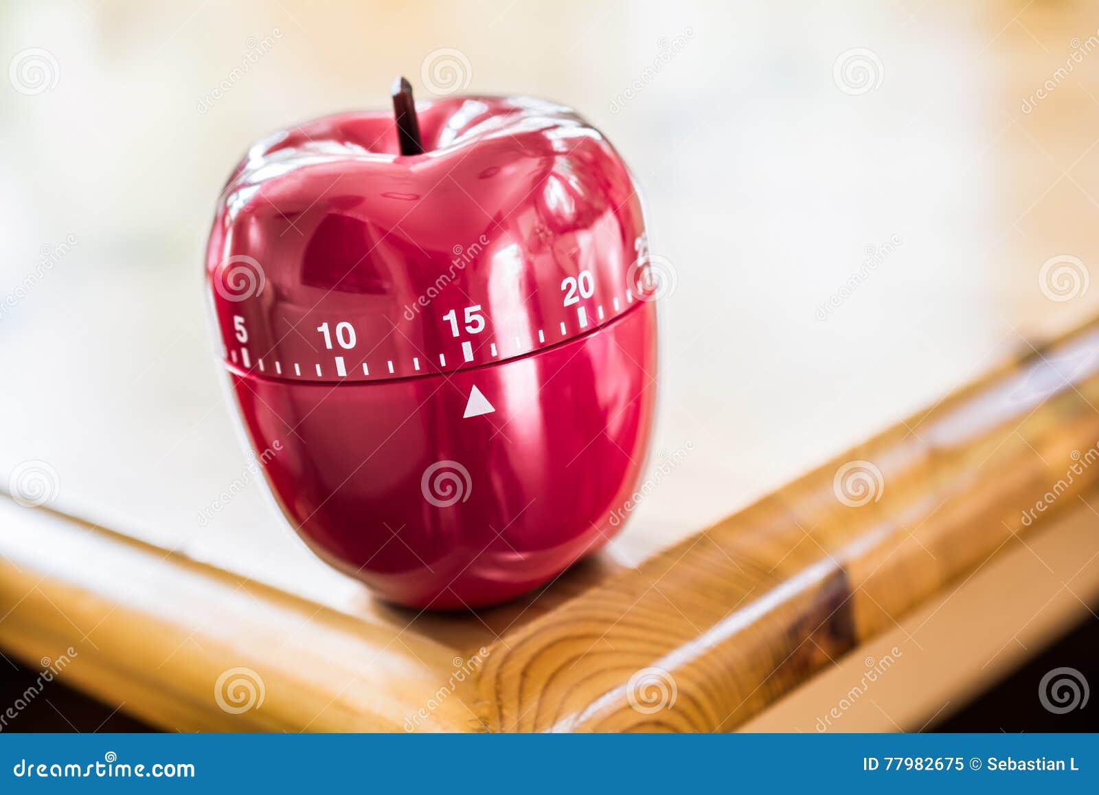 15 Minutes Kitchen Egg Timer in Apple Shape on Wooden Table Stock