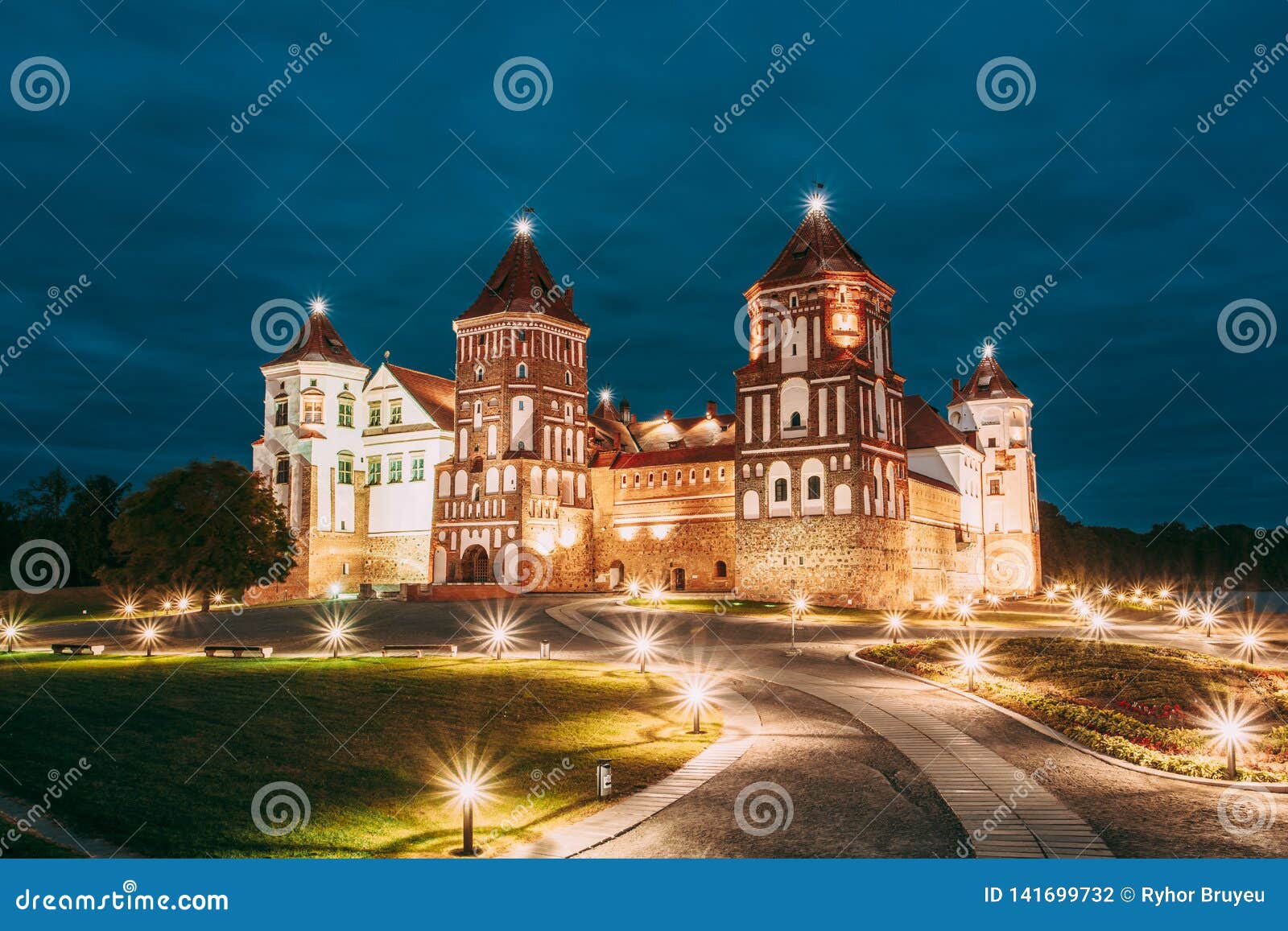mir, belarus. mir castle complex in evening illumination lighting. famous landmark, ancient gothic monument of feudalism