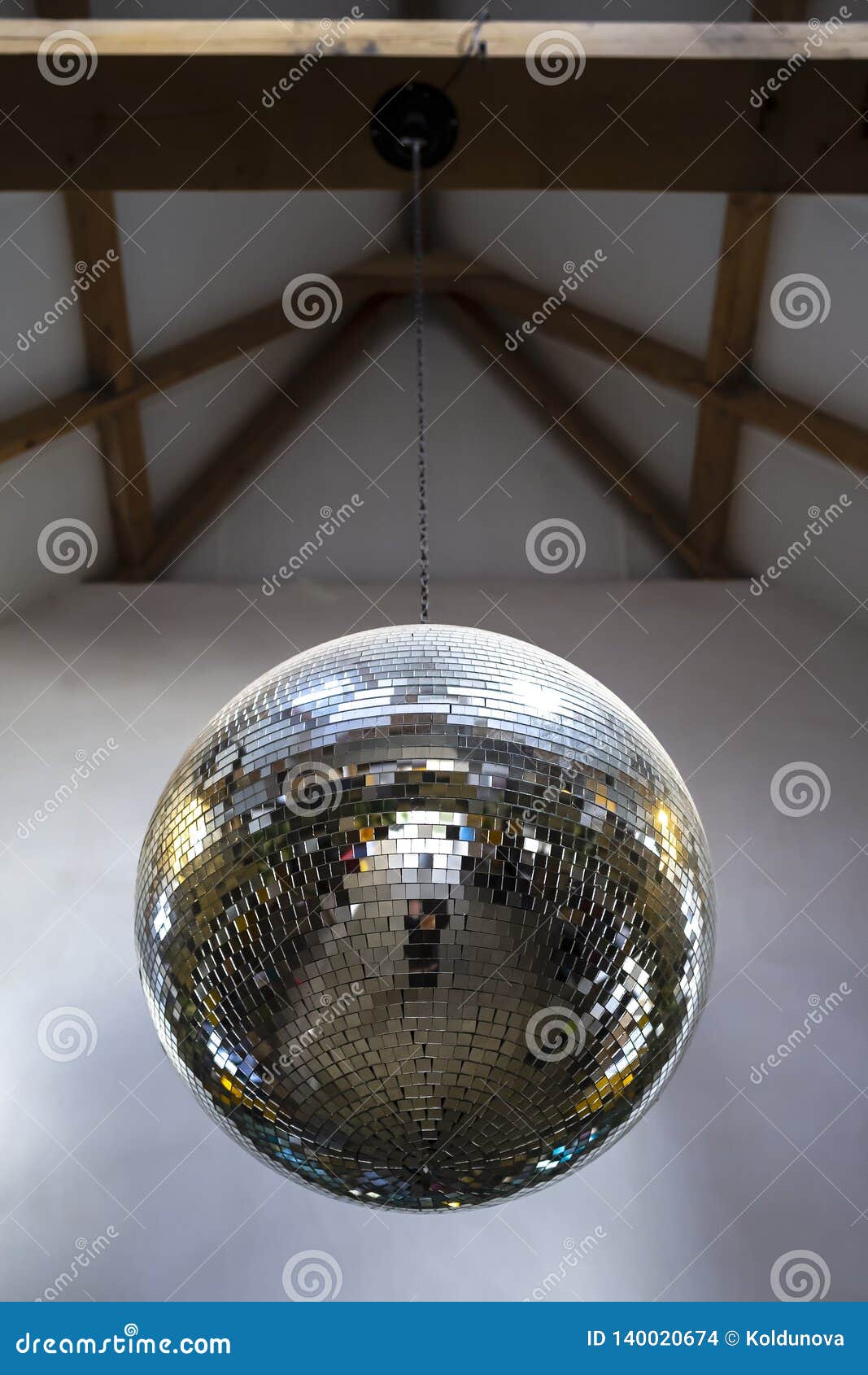 Mirror Brilliant Reflective Disco Ball Hanging On A Chain From